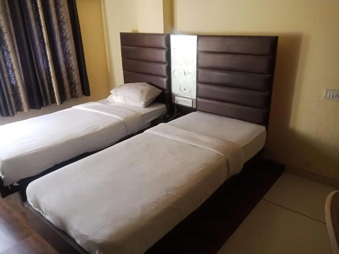Bed in hotel kadamb inn