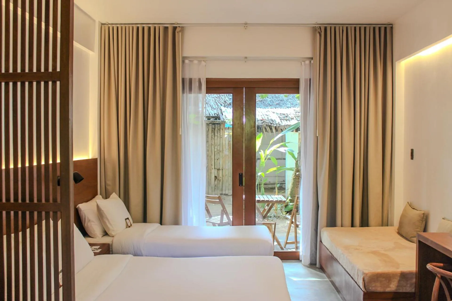 Photo of the whole room, Bed in The Henry Resort Siargao at Kermit