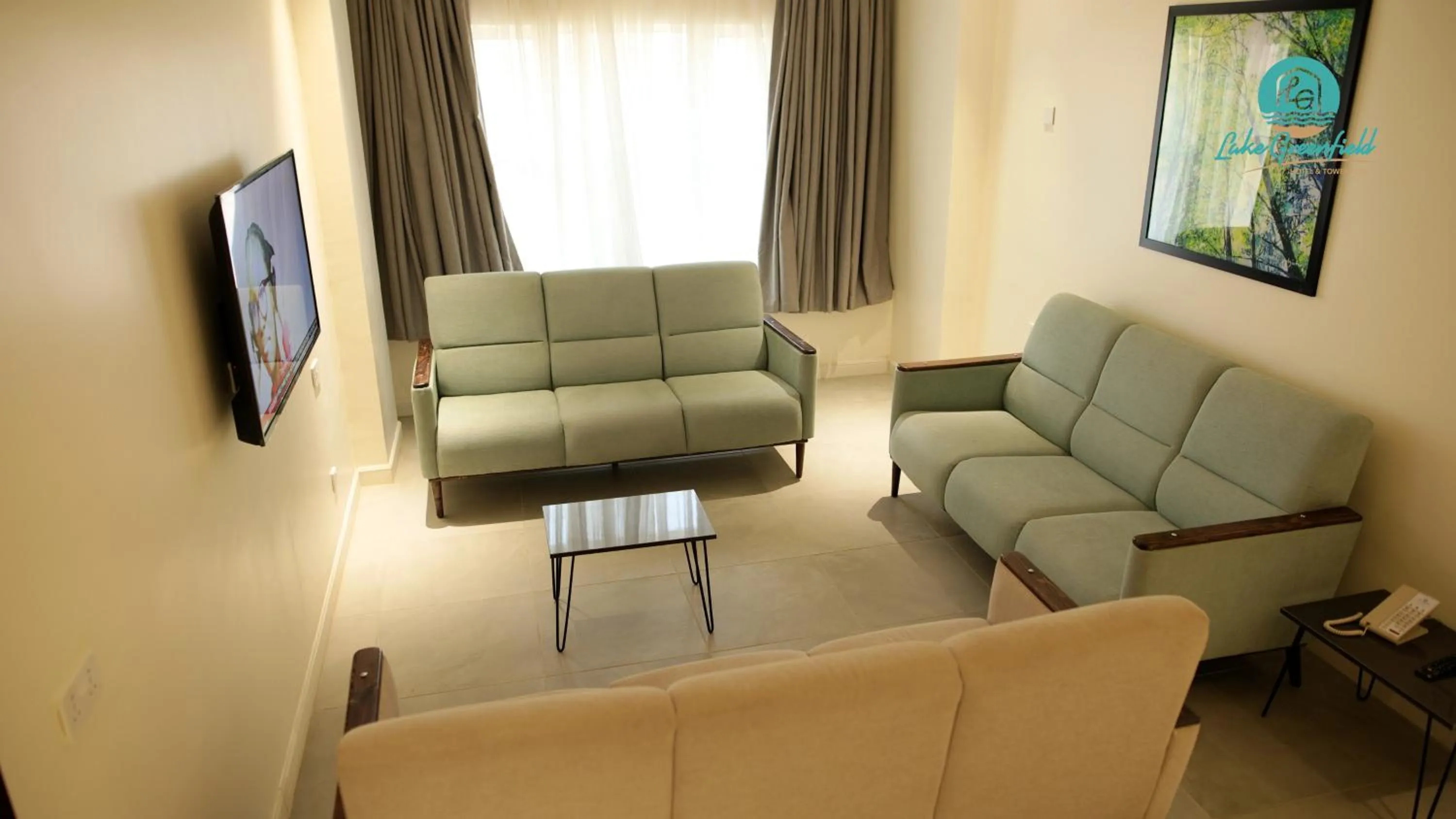 Communal lounge/ TV room in Lake Greenfield Hotel and Towers