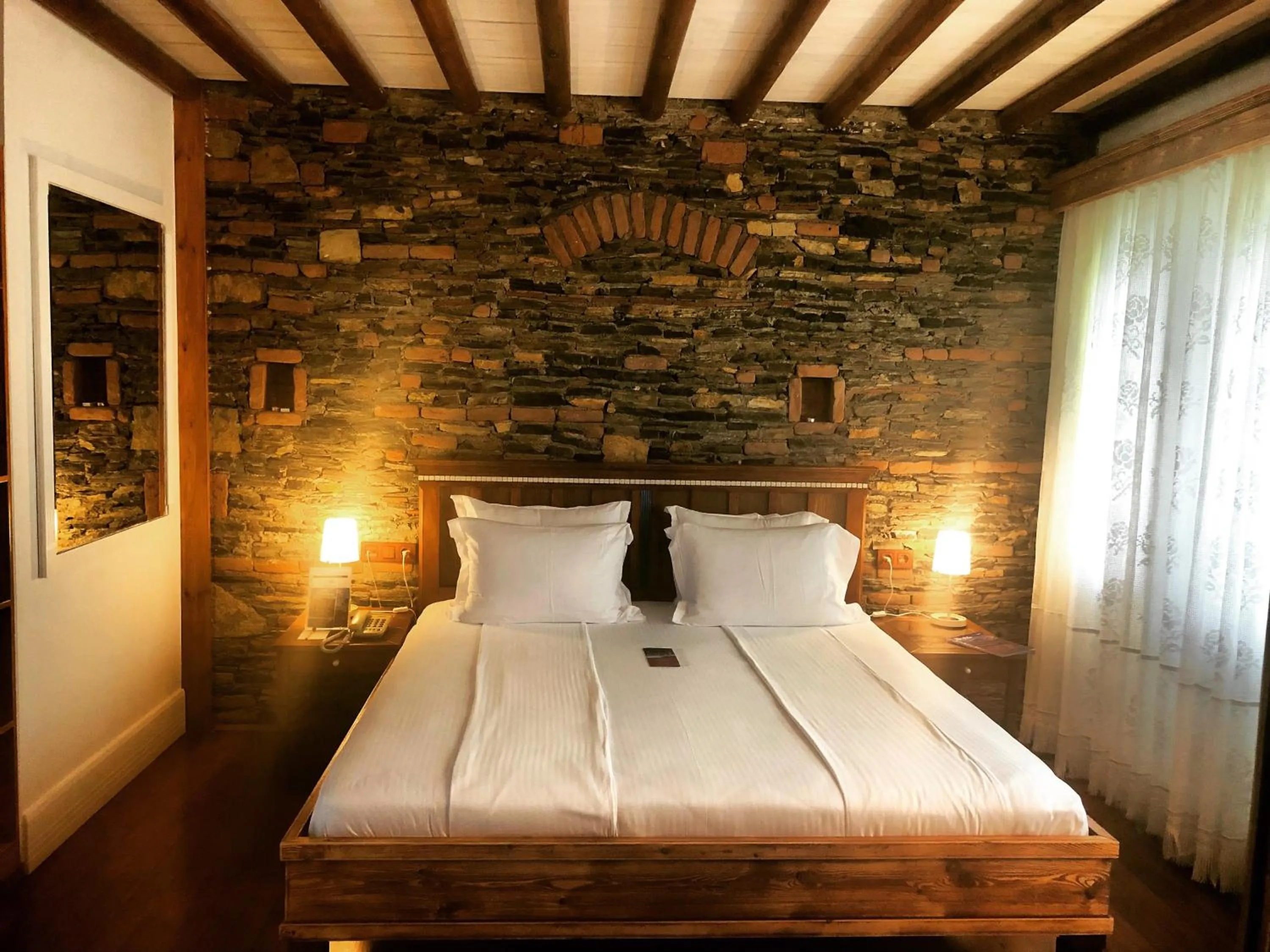 Bed in El Vino Hotel & Suites