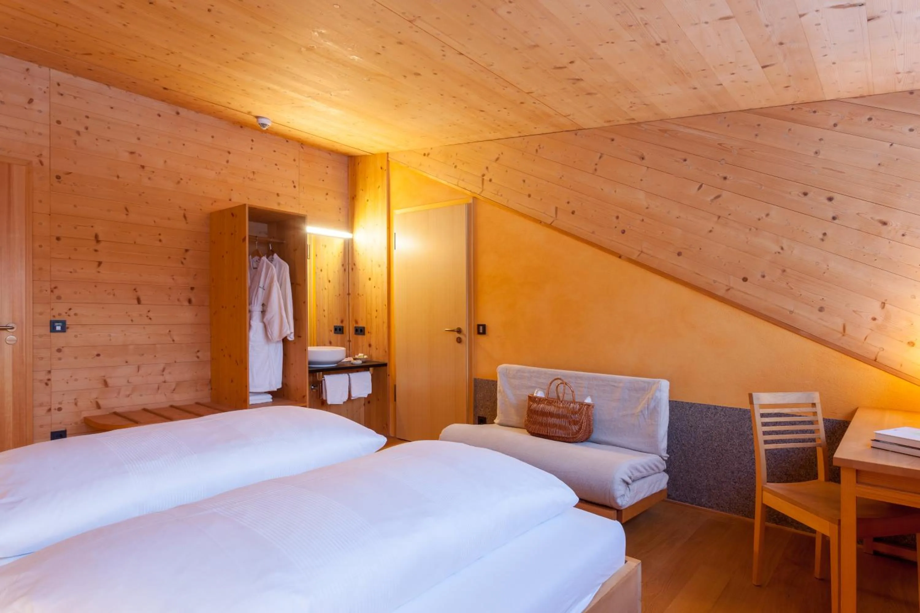 Bed in Biohotel Mattlihüs