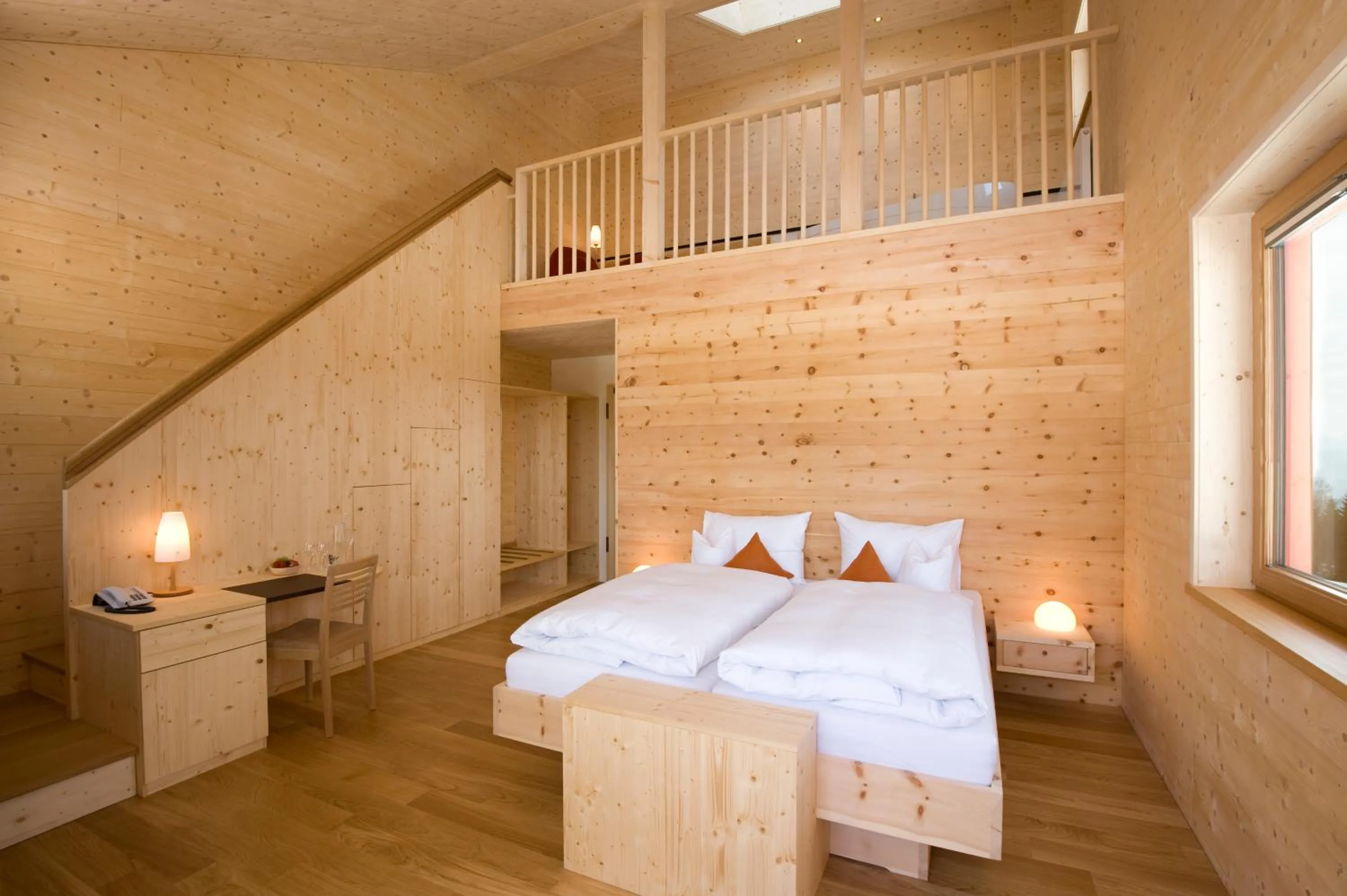 Bed in Biohotel Mattlihüs