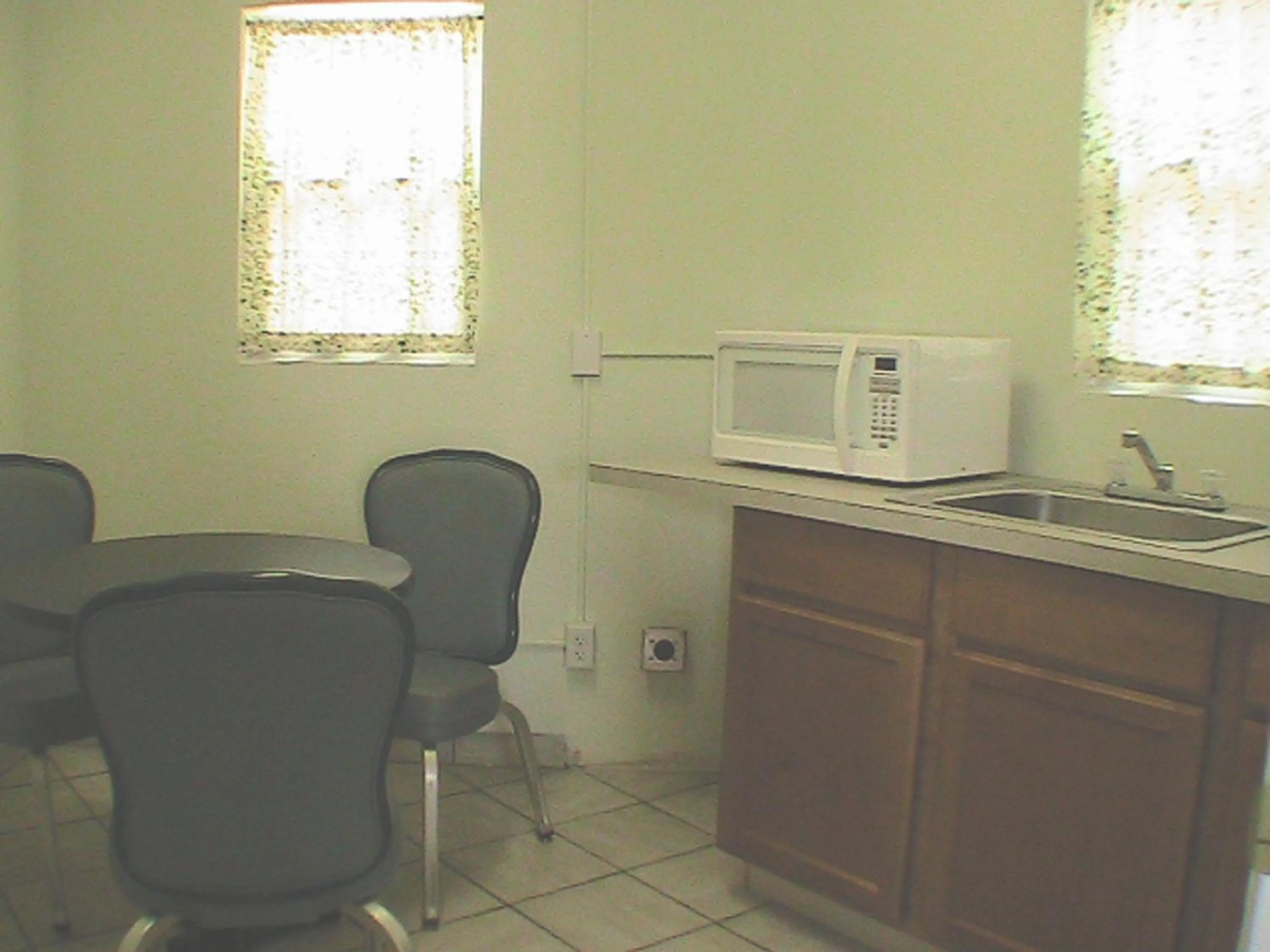 Kitchen or kitchenette in At Home Express Tangerine Inn