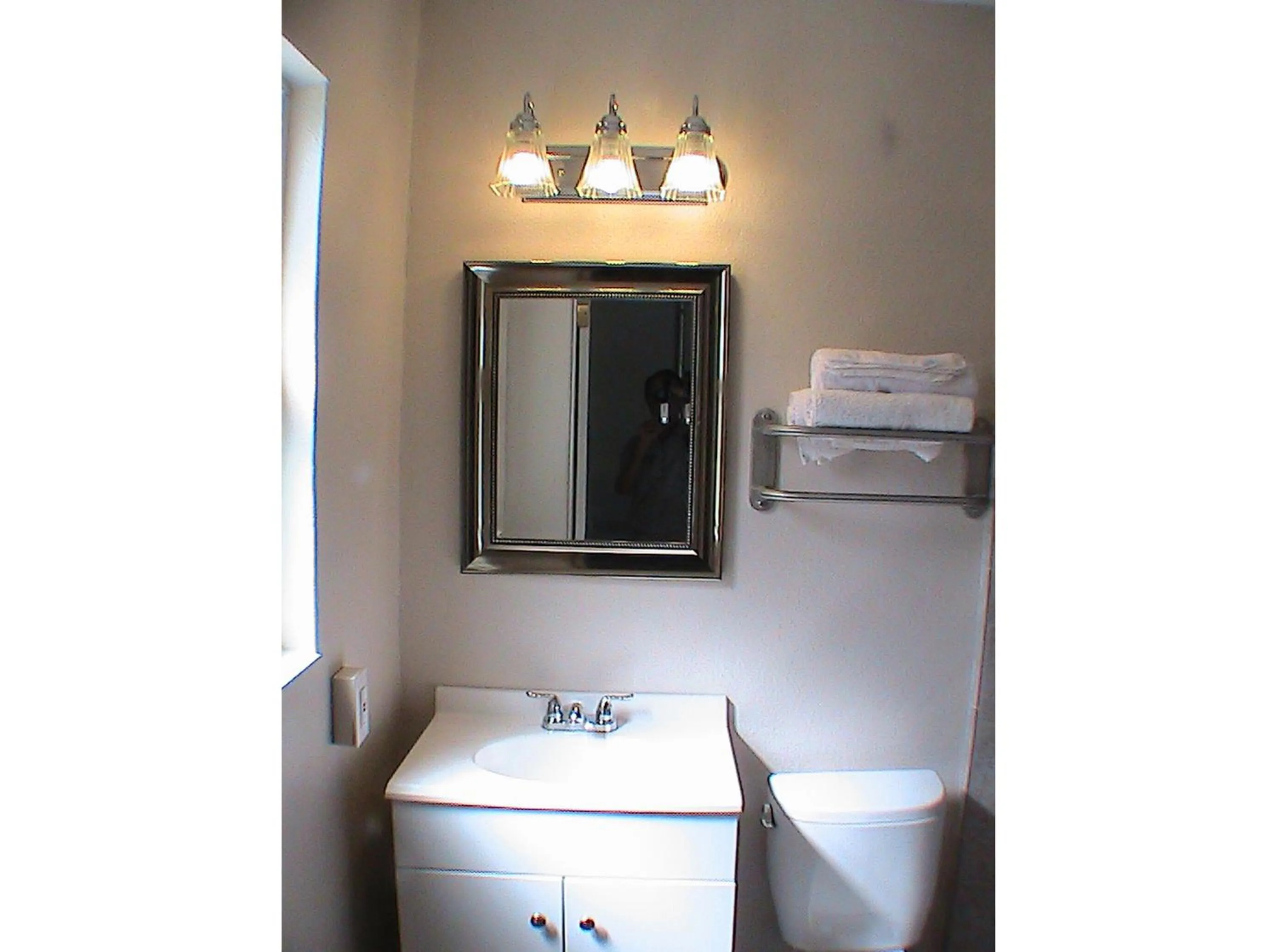 Bathroom in At Home Express Tangerine Inn