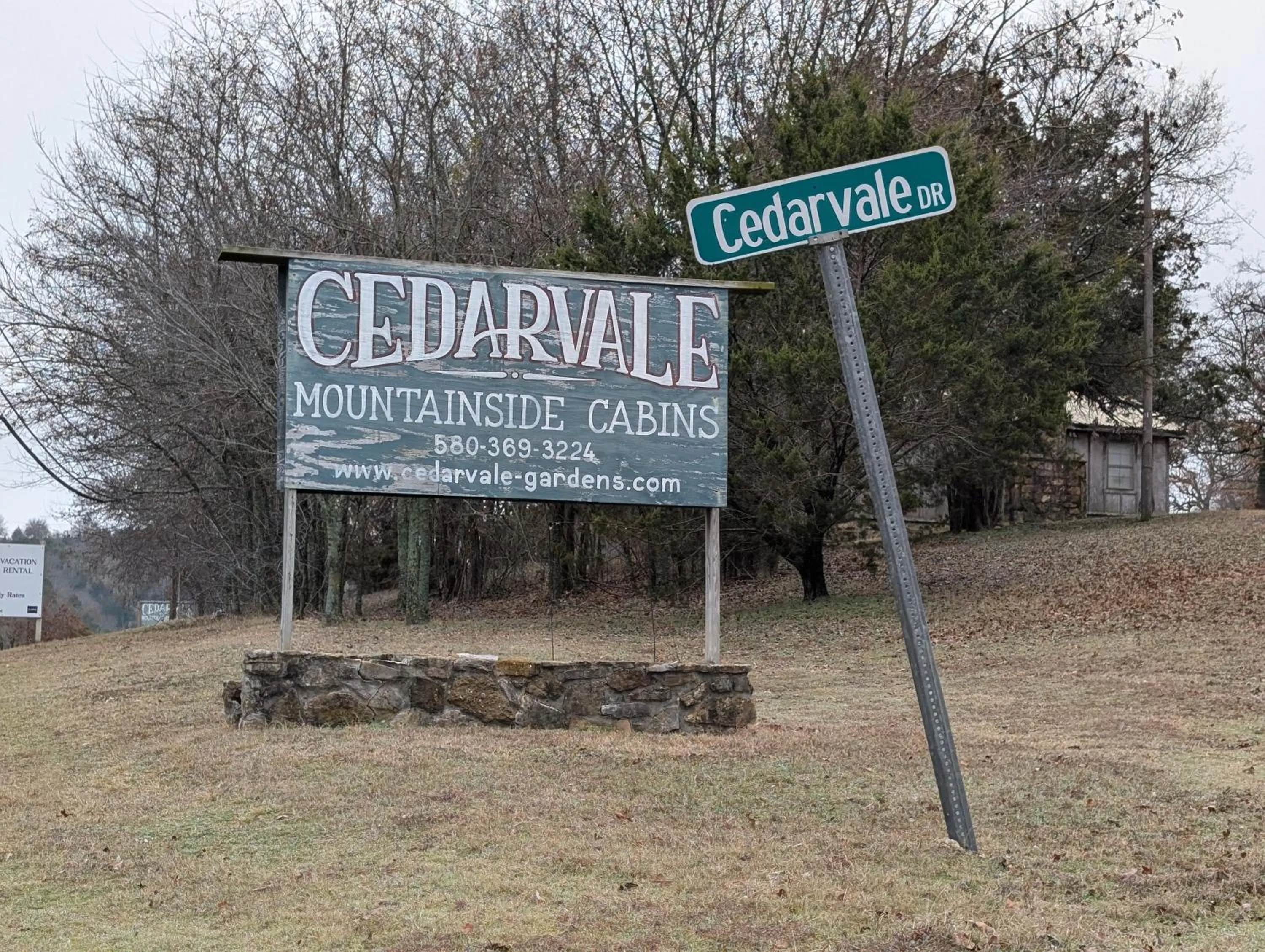 Property logo or sign in Cedarvale Cabins Turner Falls
