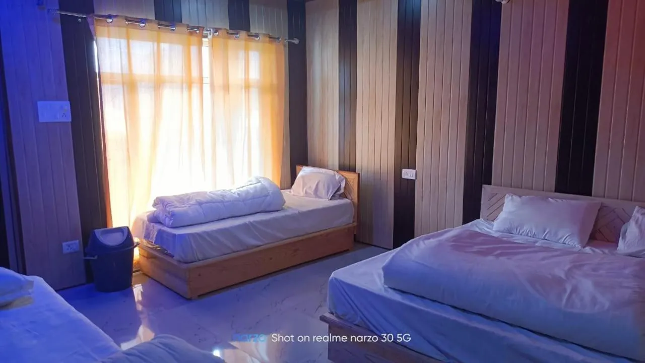Bed in Chaukhamba view Resort