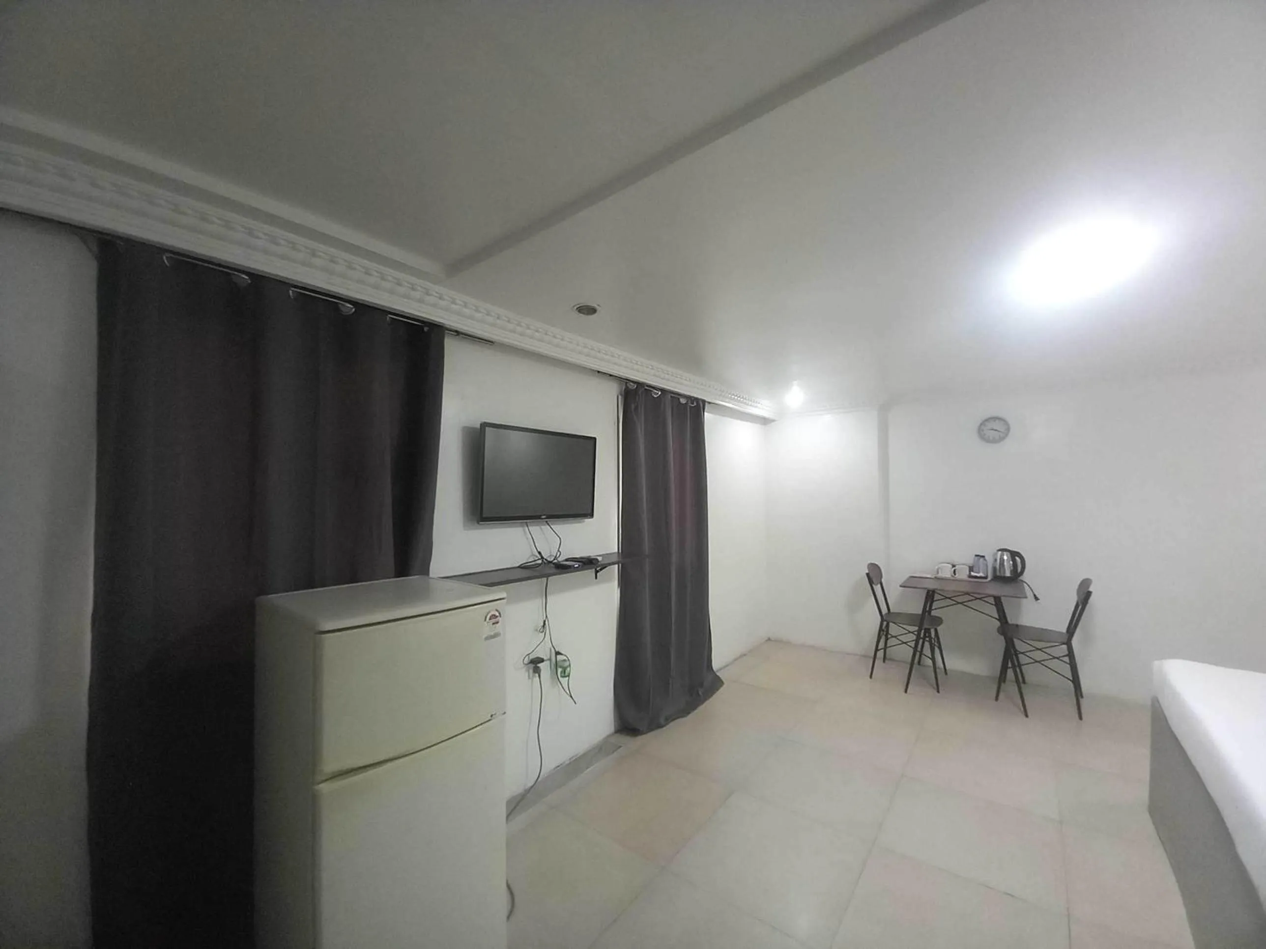 Bedroom in OYO 1141 Healing Condo Hotel