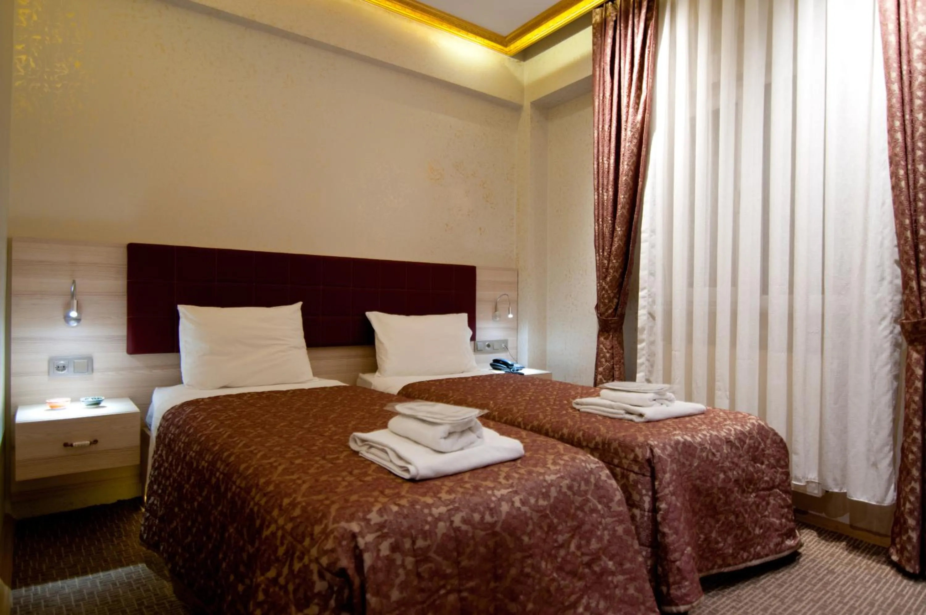 Photo of the whole room, Bed in Grand Ambiance Hotel