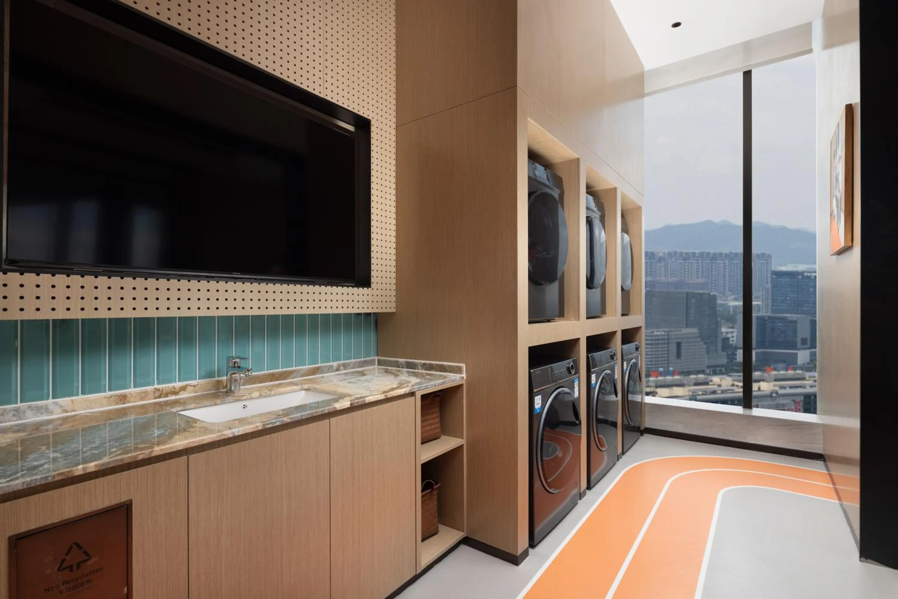 washing machine in Home2 Suite by Hilton Yiwu World Trade Center