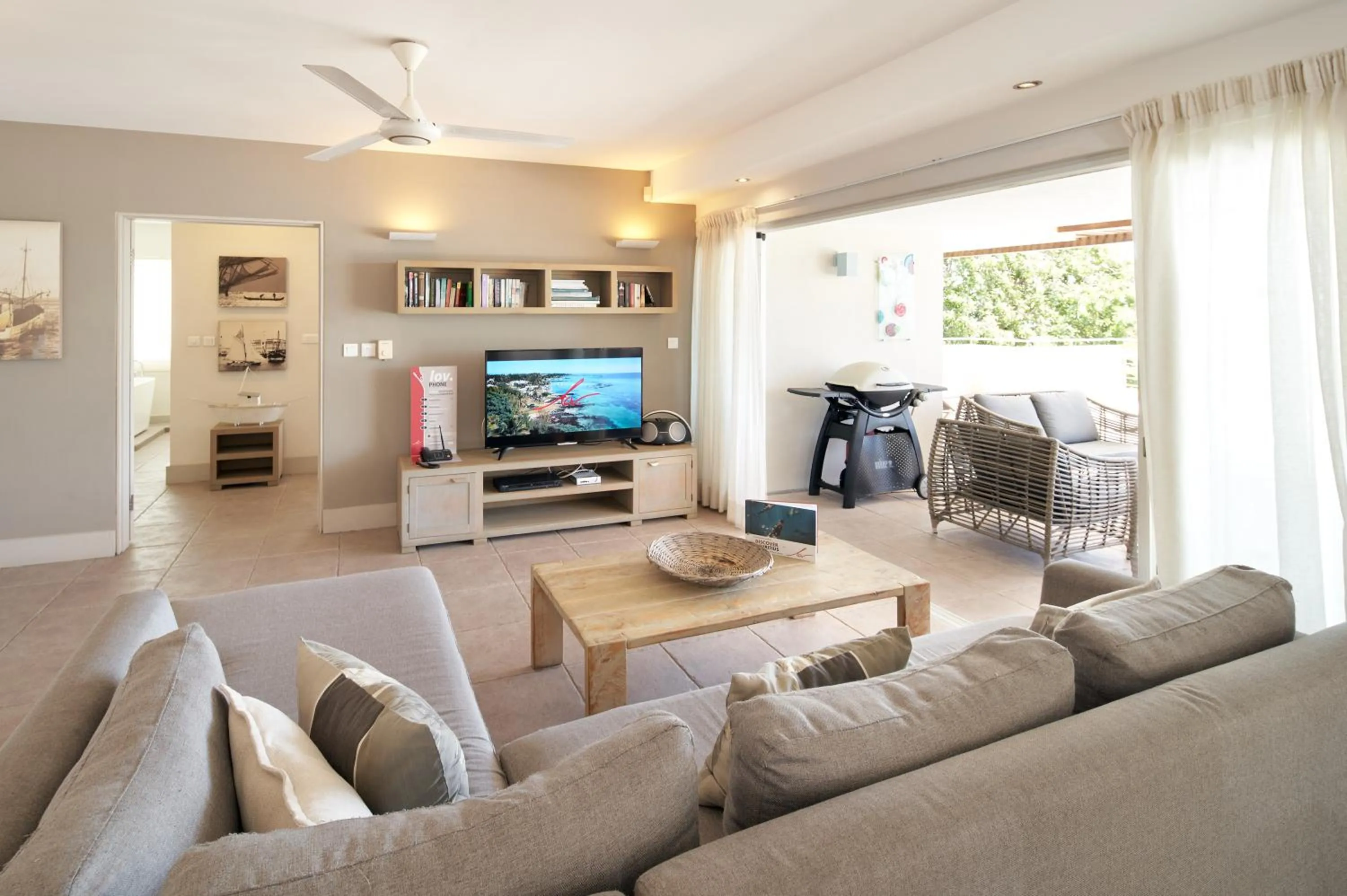 Communal lounge/ TV room in Cape Point Seafront by LOV Mauritius