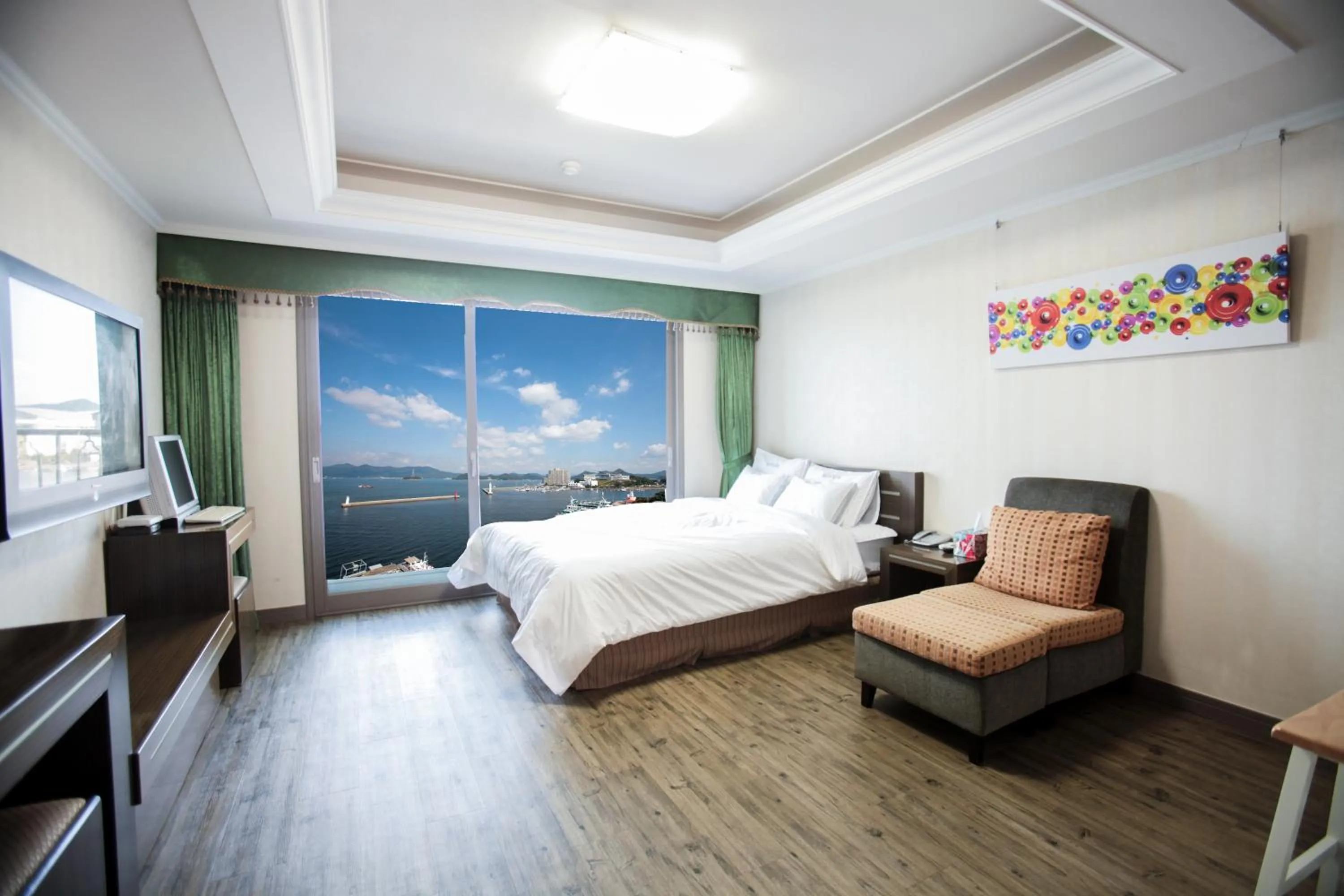 Bed in Tongyeong Bay Condo Hotel