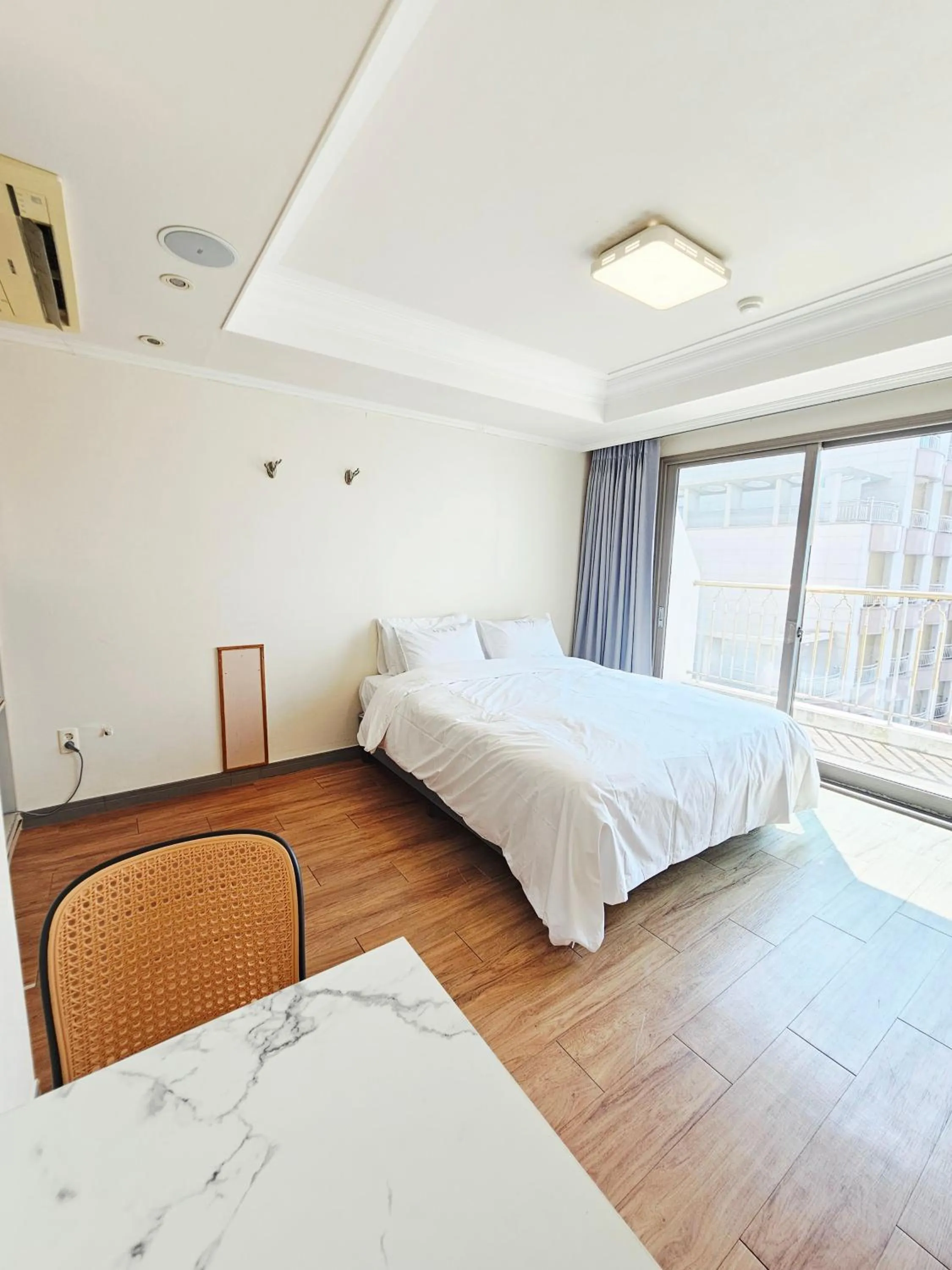 Bed in Tongyeong Bay Condo Hotel