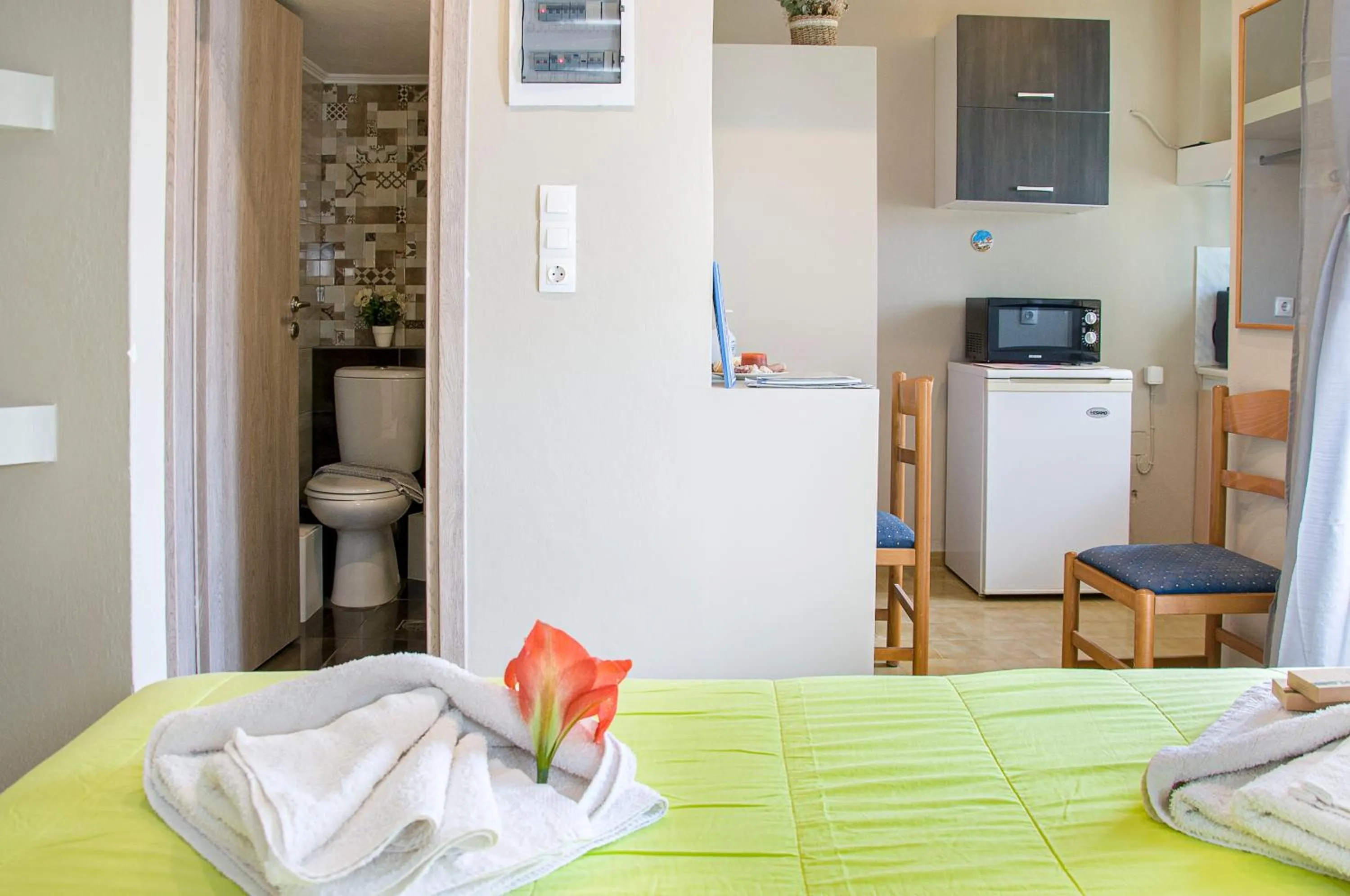 Toilet, Bed in Christina Rooms