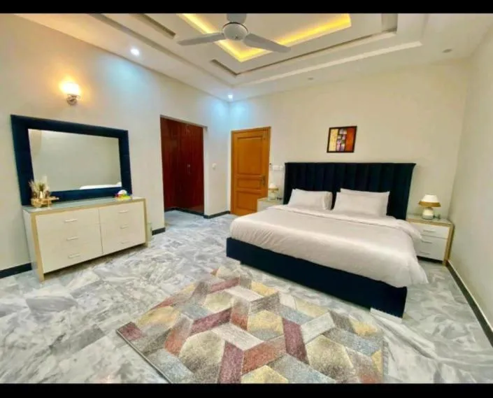 Bed in Travis Executive Guest House Islamabad