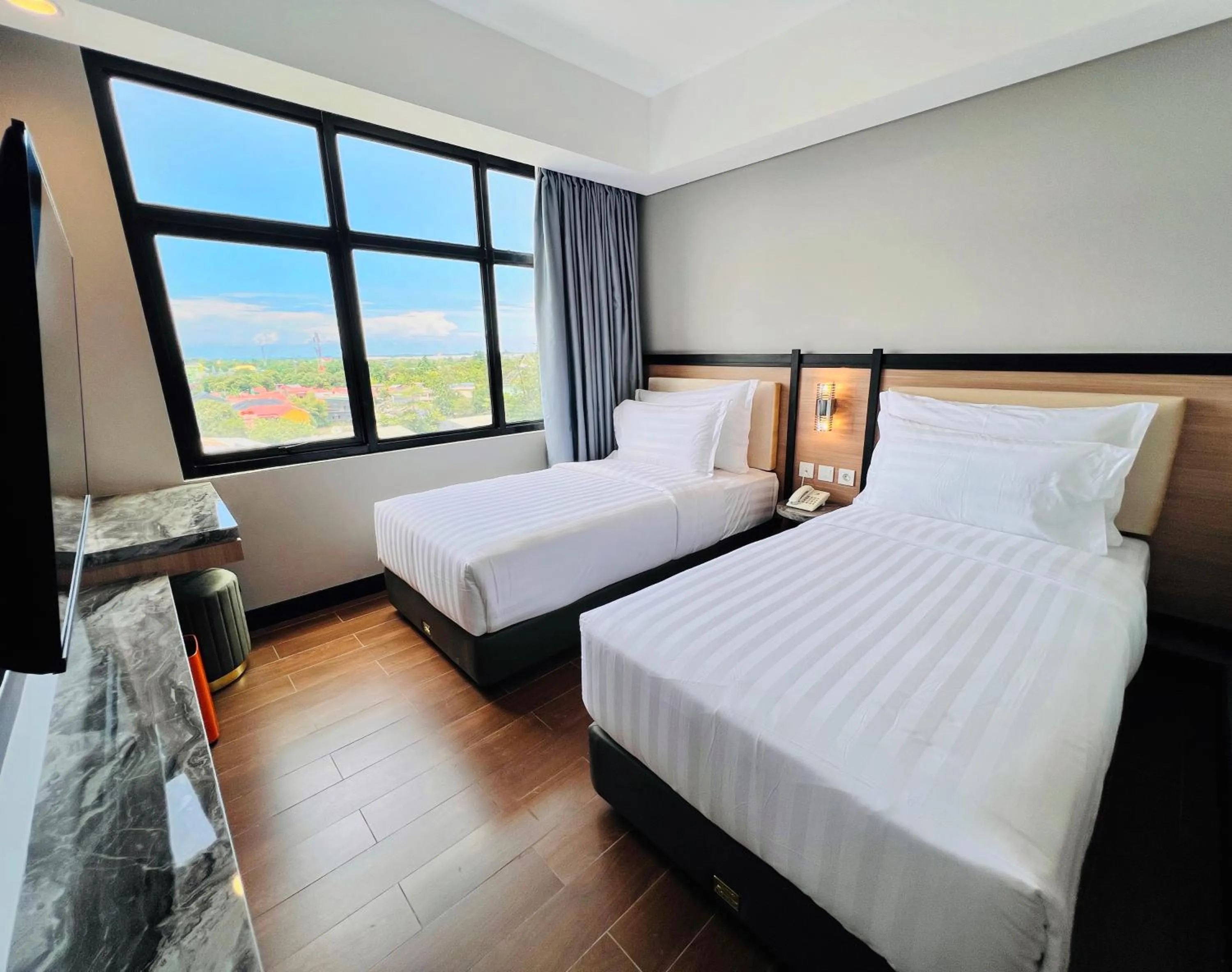 Bed in d'primahotel Airport Sultan Hasanuddin Makassar