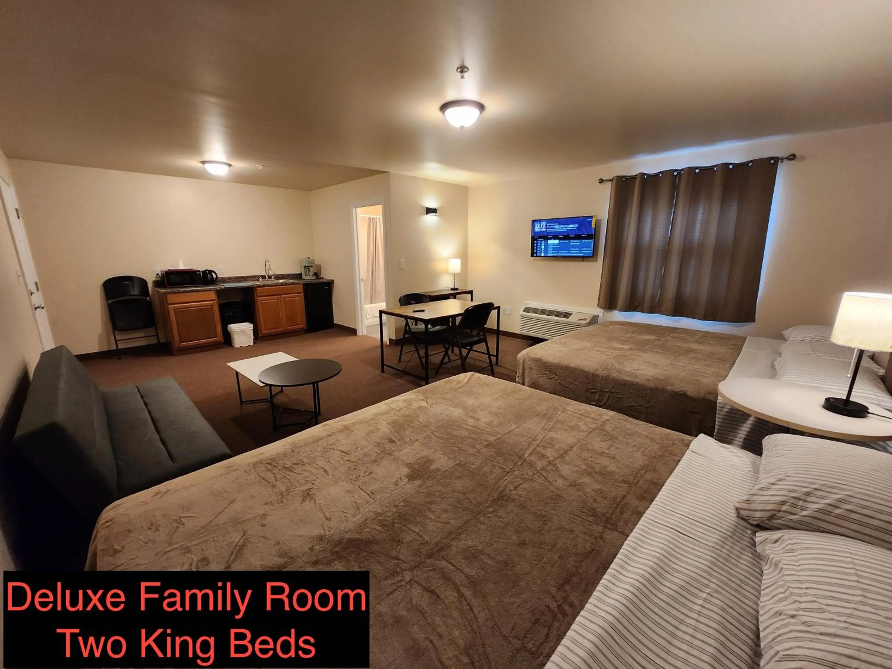 Bed in Stay Inn and Suites