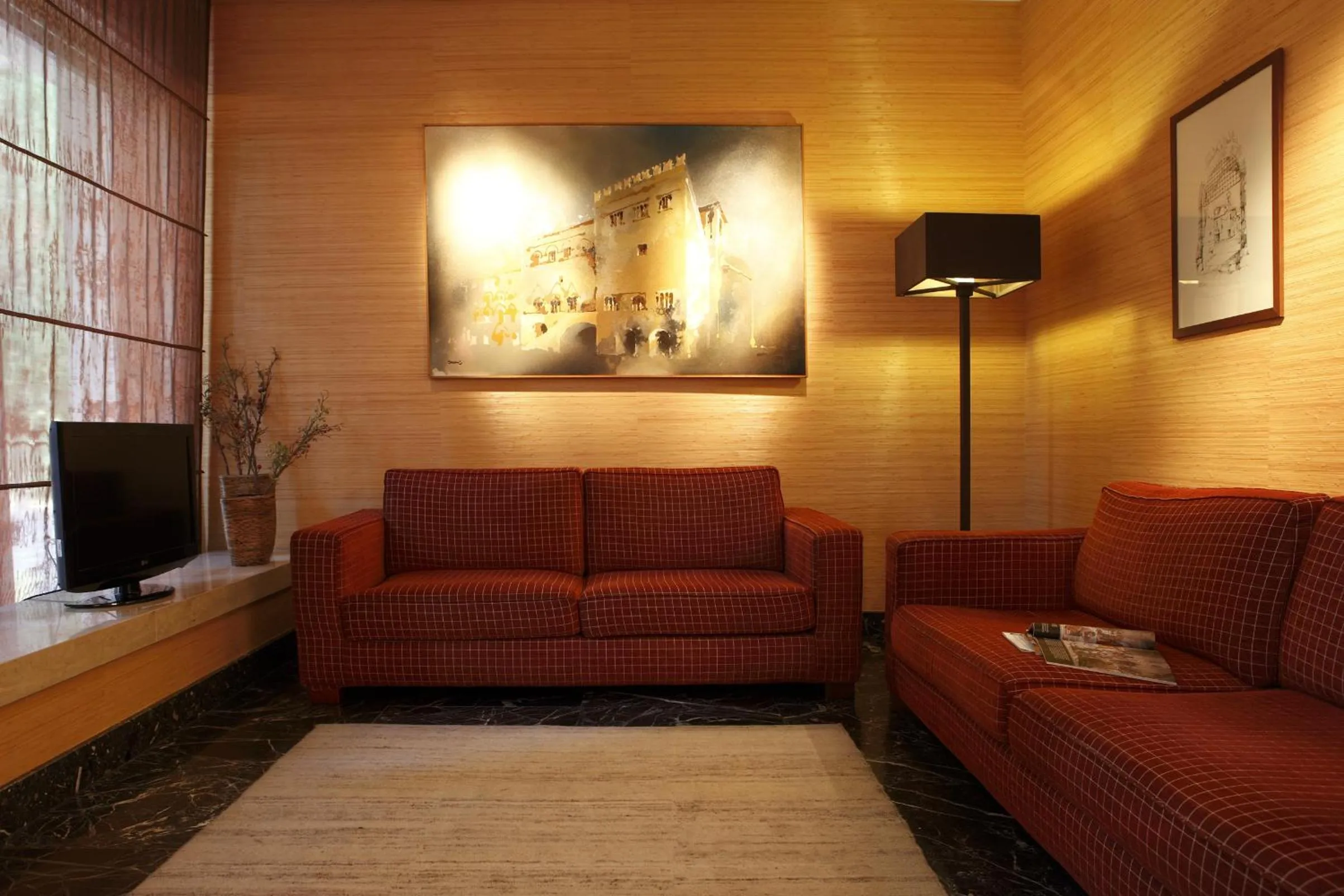 Communal lounge/ TV room in Villa Luisa