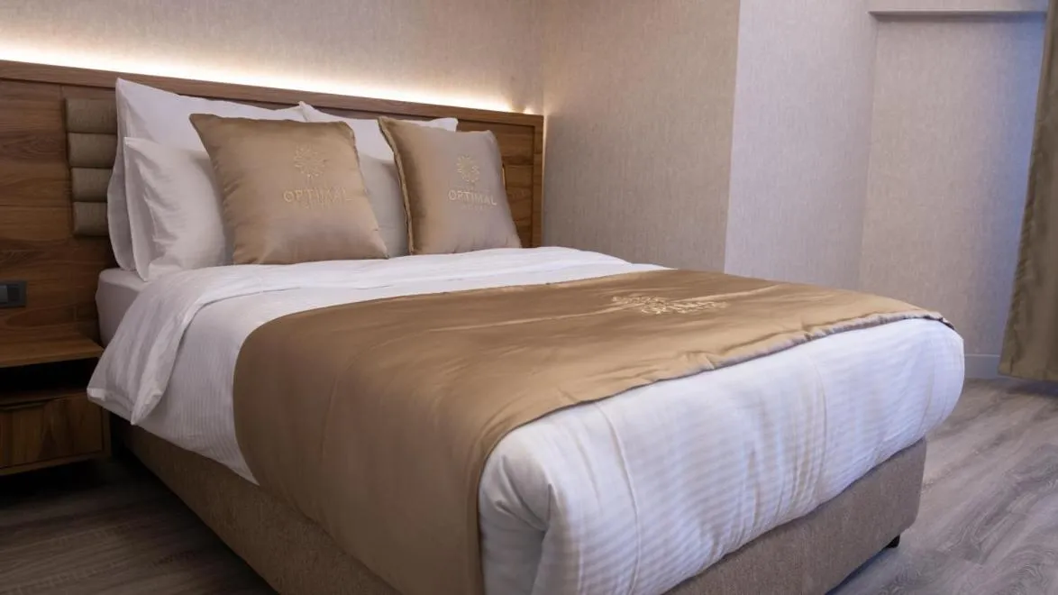 Bed in Optimal Hotel