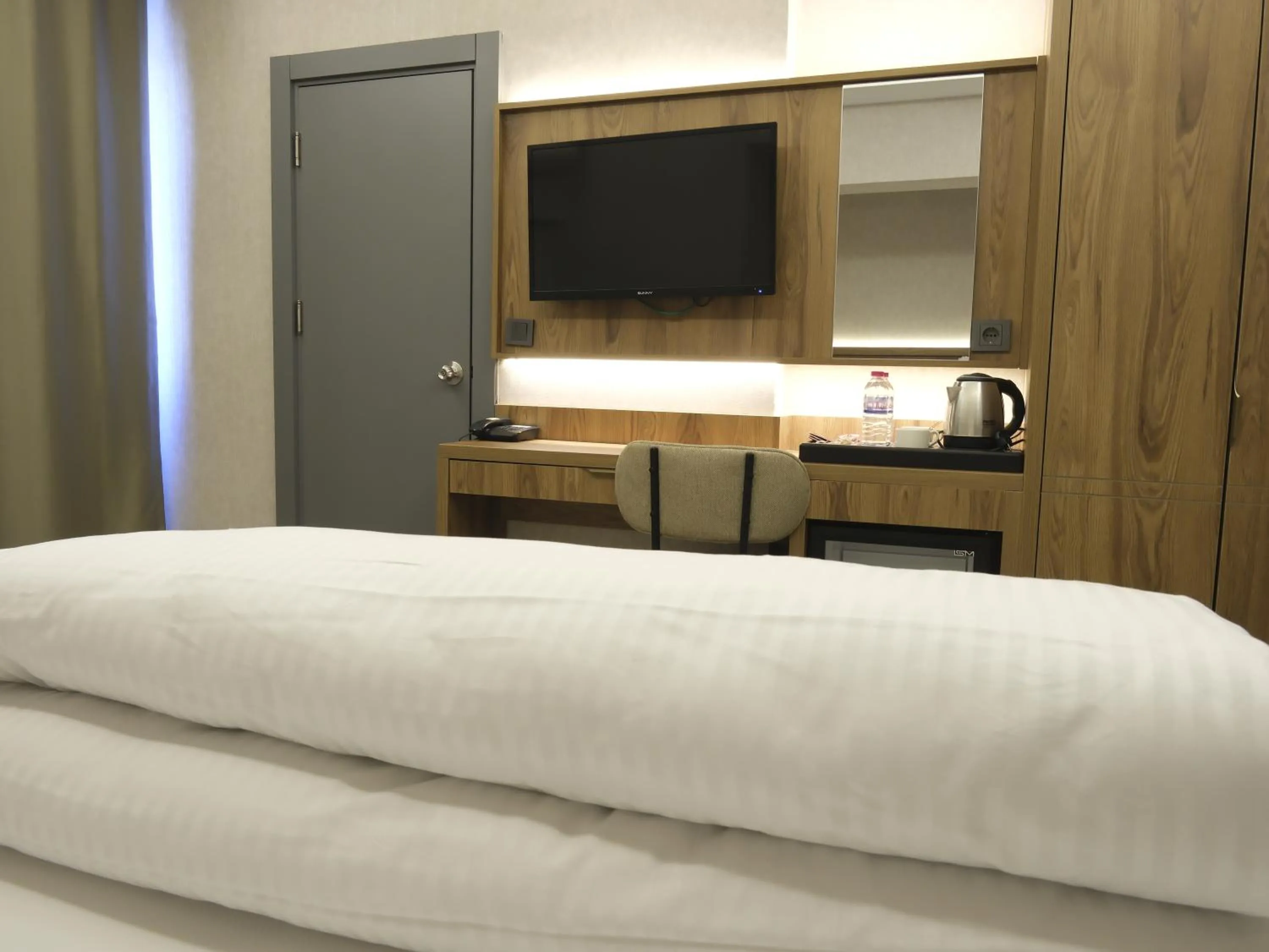 Bed in Optimal Hotel