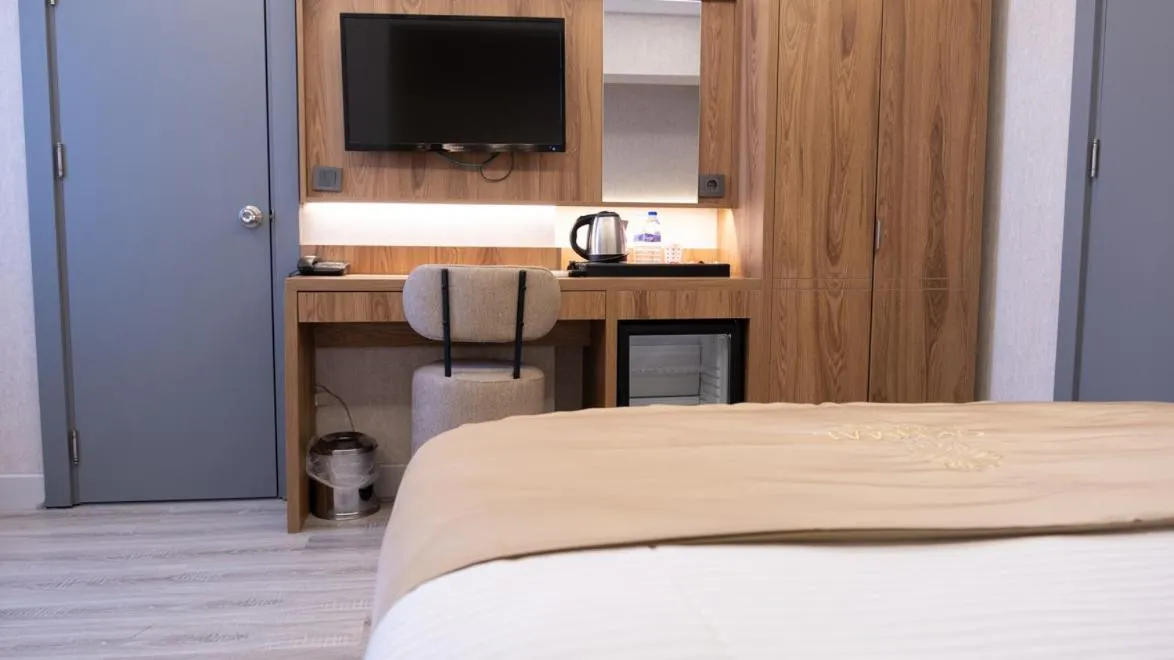 Bed in Optimal Hotel