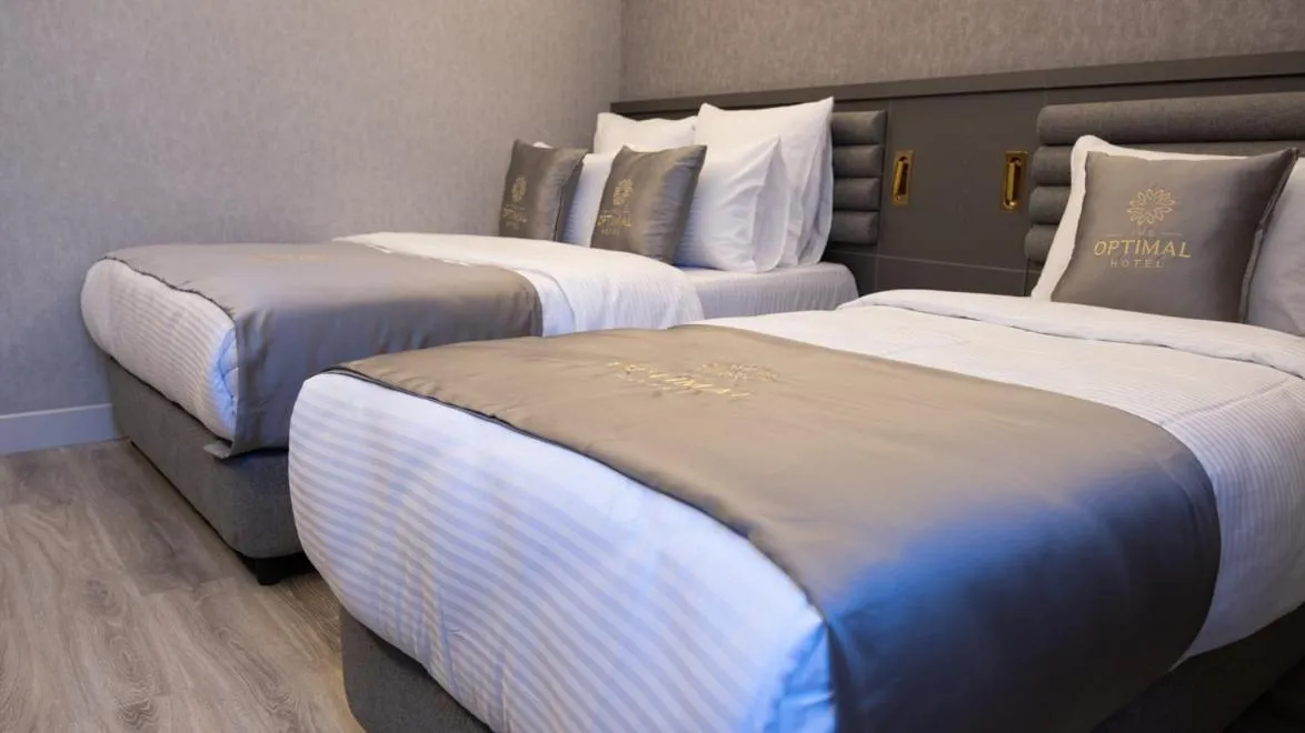 Bed in Optimal Hotel
