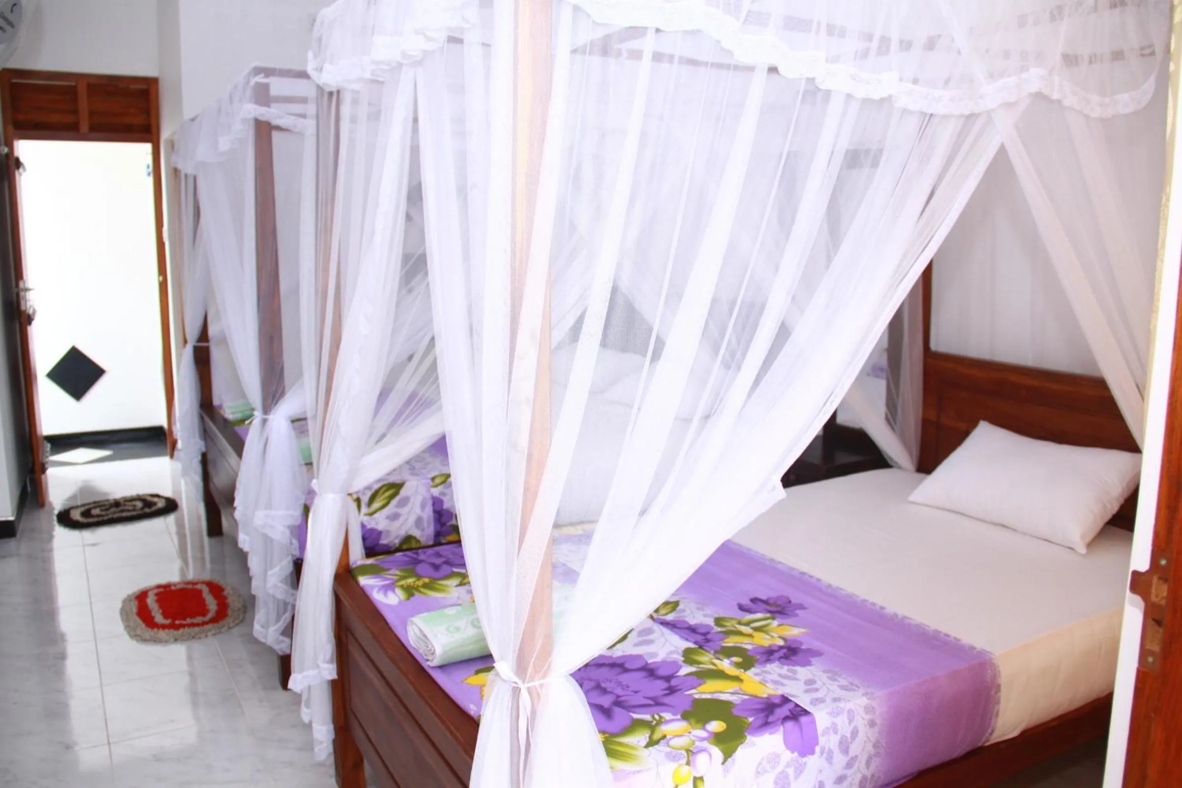 Photo of the whole room, Bed in Orchid Rest