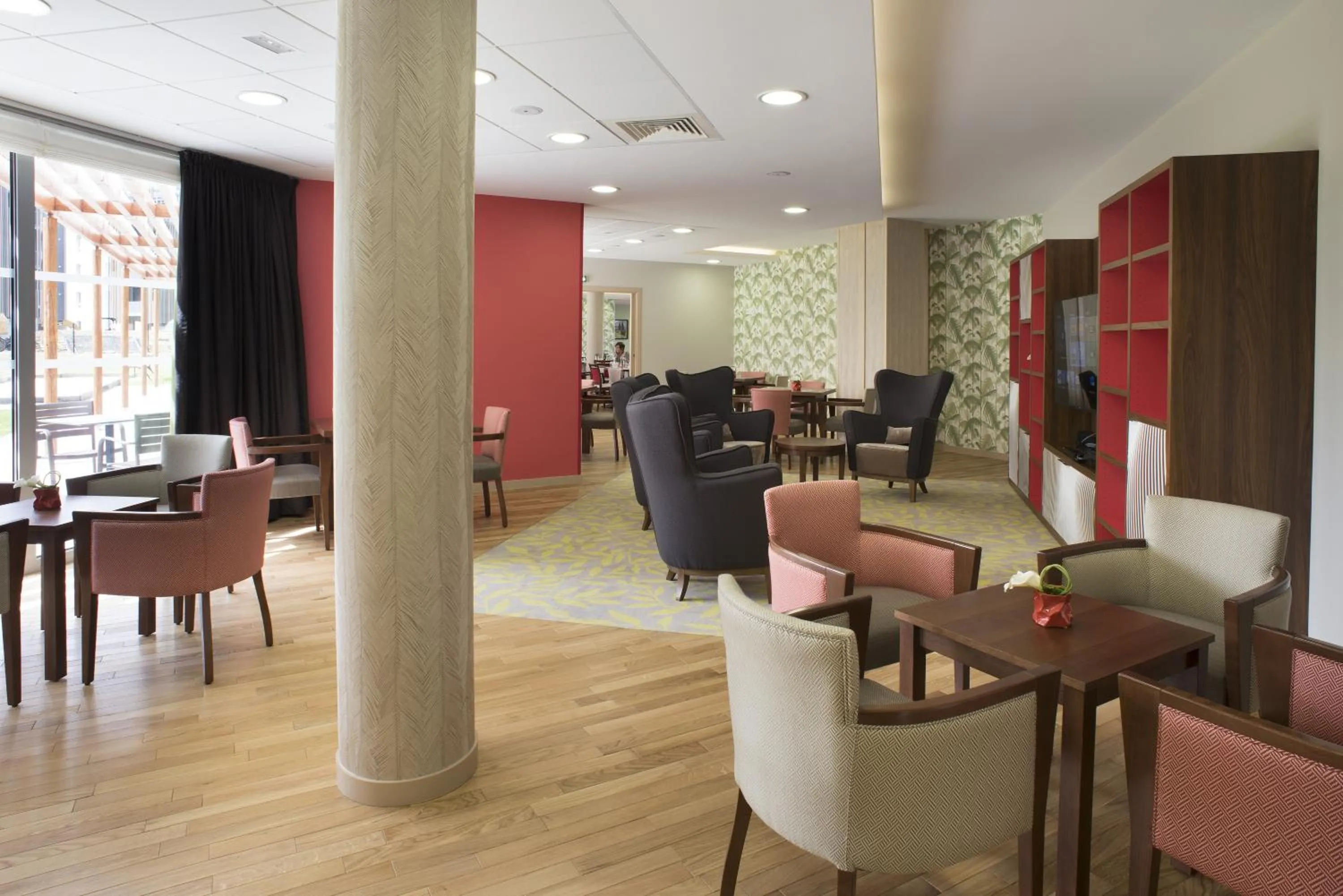 Communal lounge/ TV room in Domitys Le Palmier du Roi