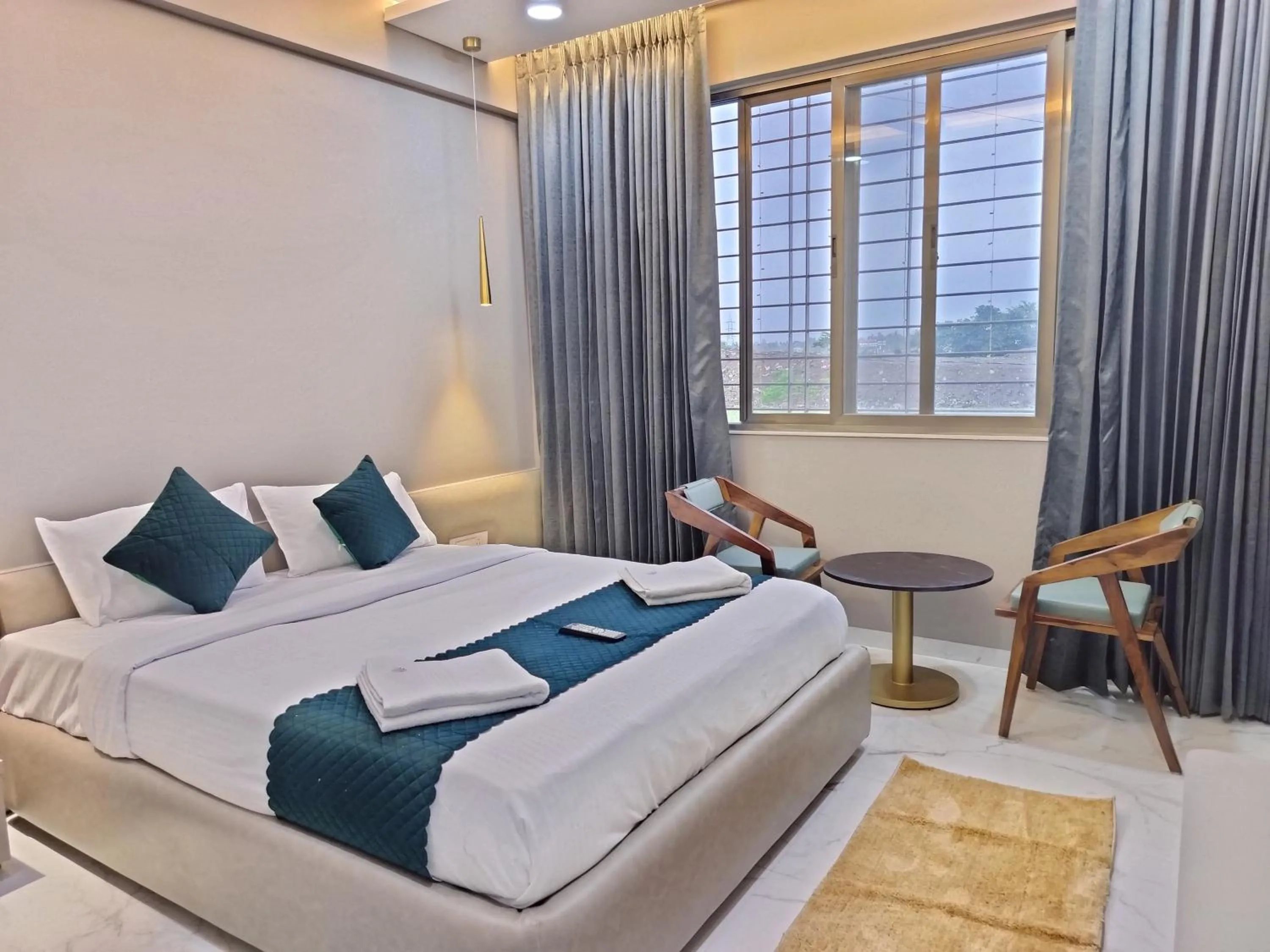 Bedroom, Bed in Hotel Laxmi Elite Karad