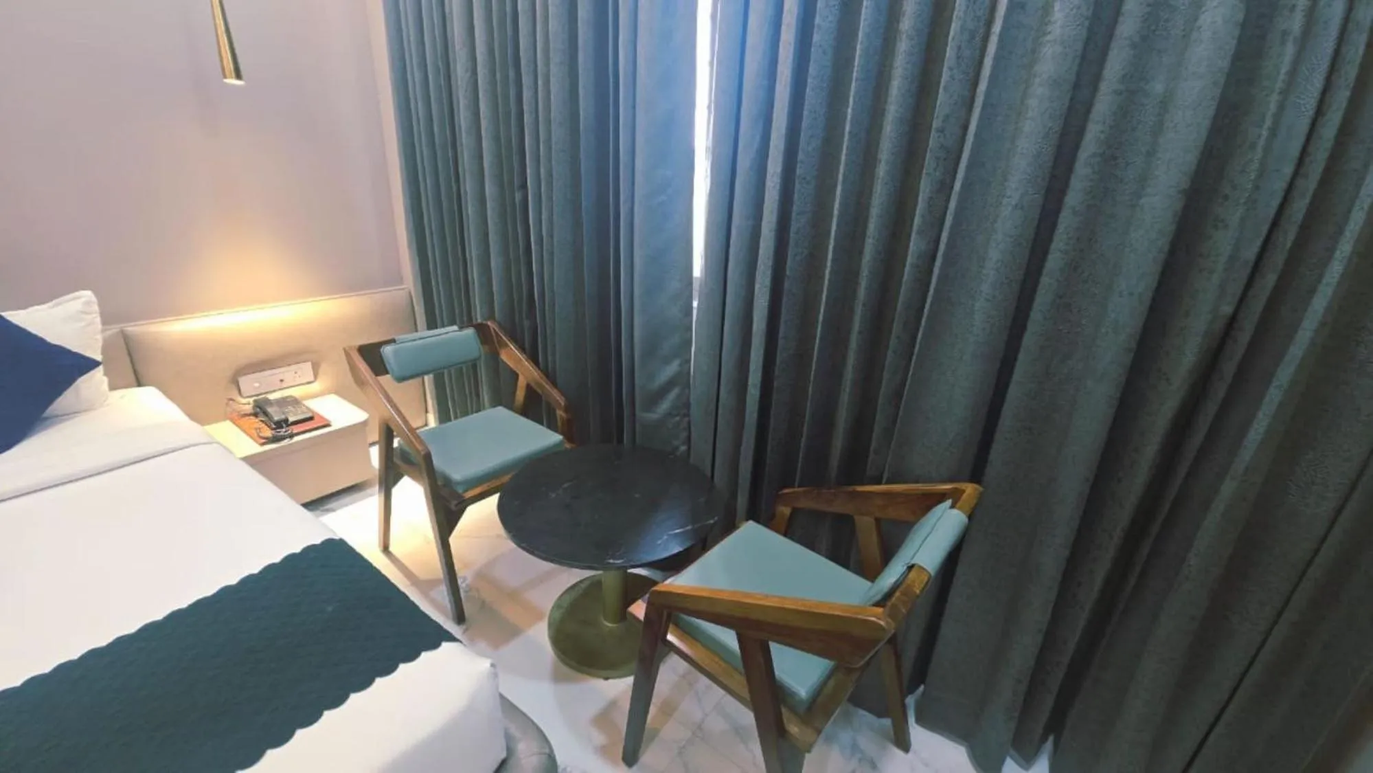 Living room, Bed in Hotel Laxmi Elite Karad