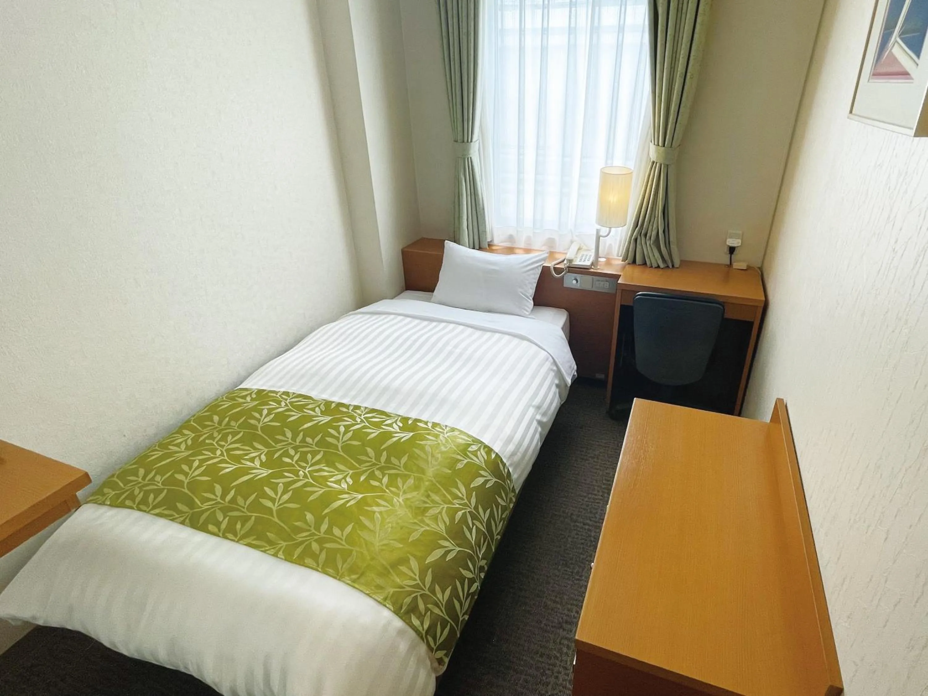Photo of the whole room, Bed in Hotel Hiroshima Sunplaza