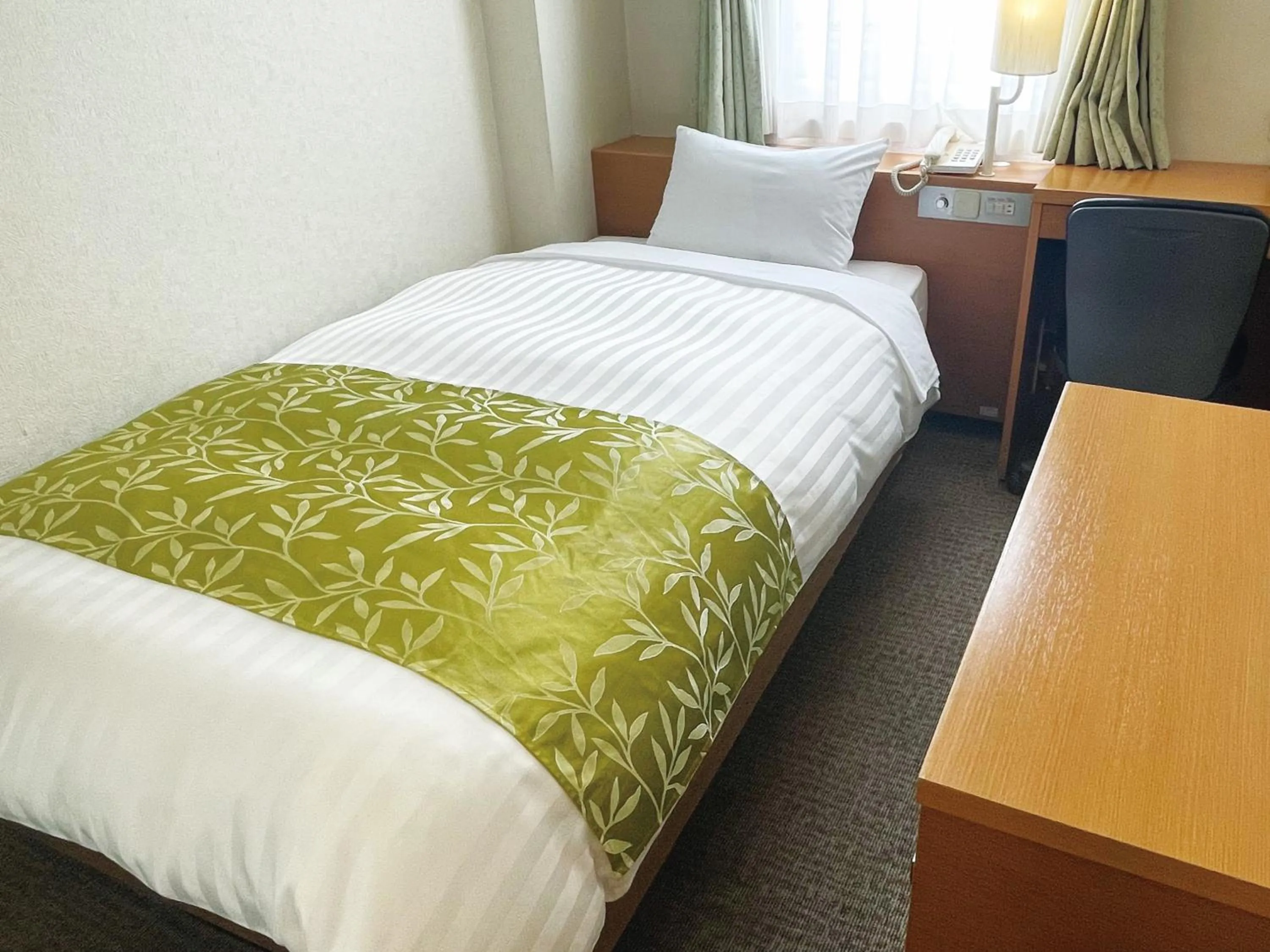 Photo of the whole room, Bed in Hotel Hiroshima Sunplaza