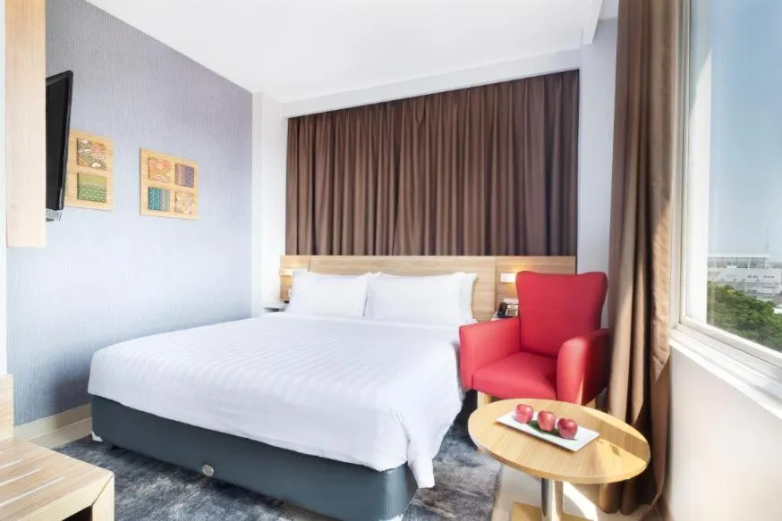 Bed in Hotel NEO Cirebon by ASTON