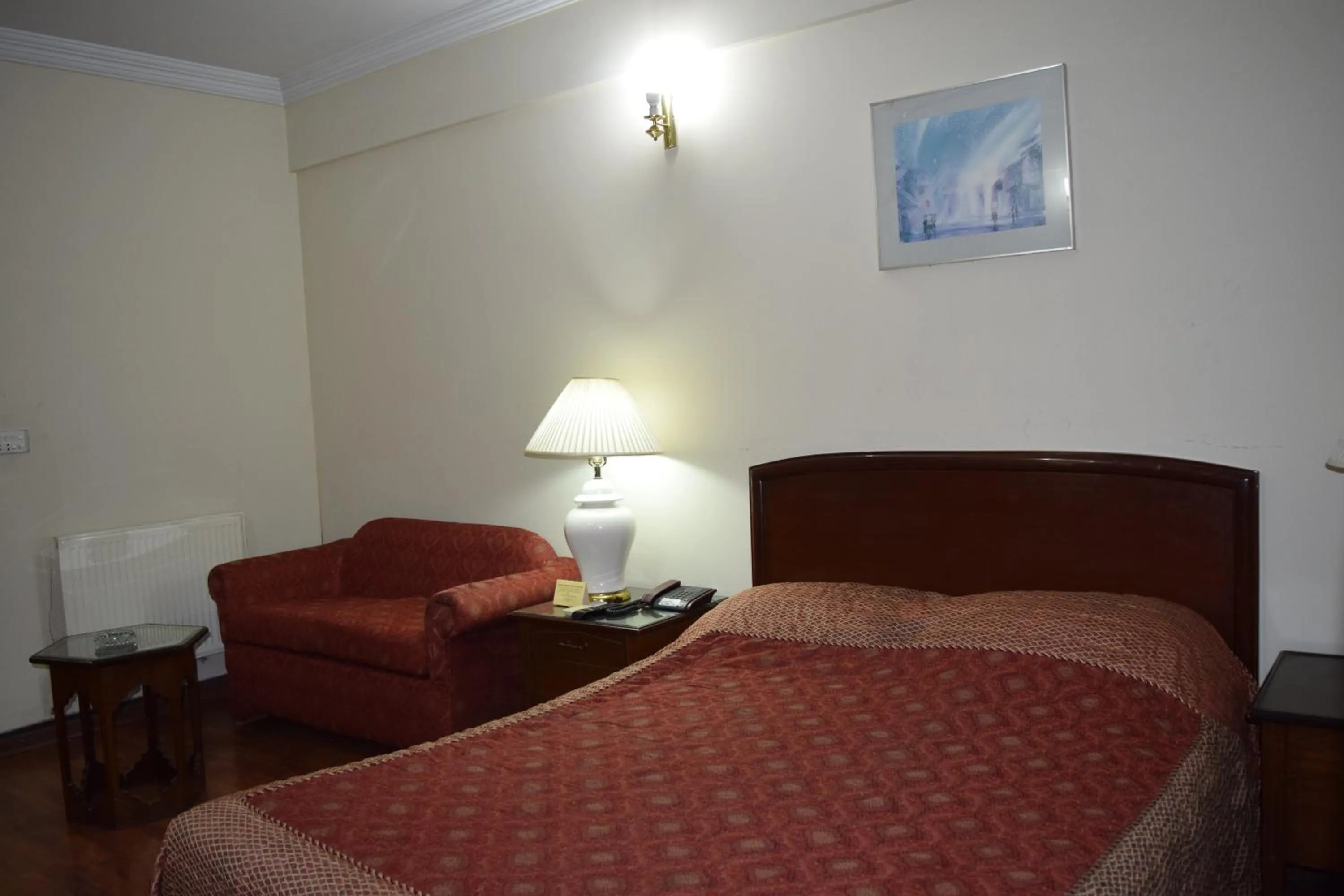 Bed in Carlton Tower Hotel Lahore