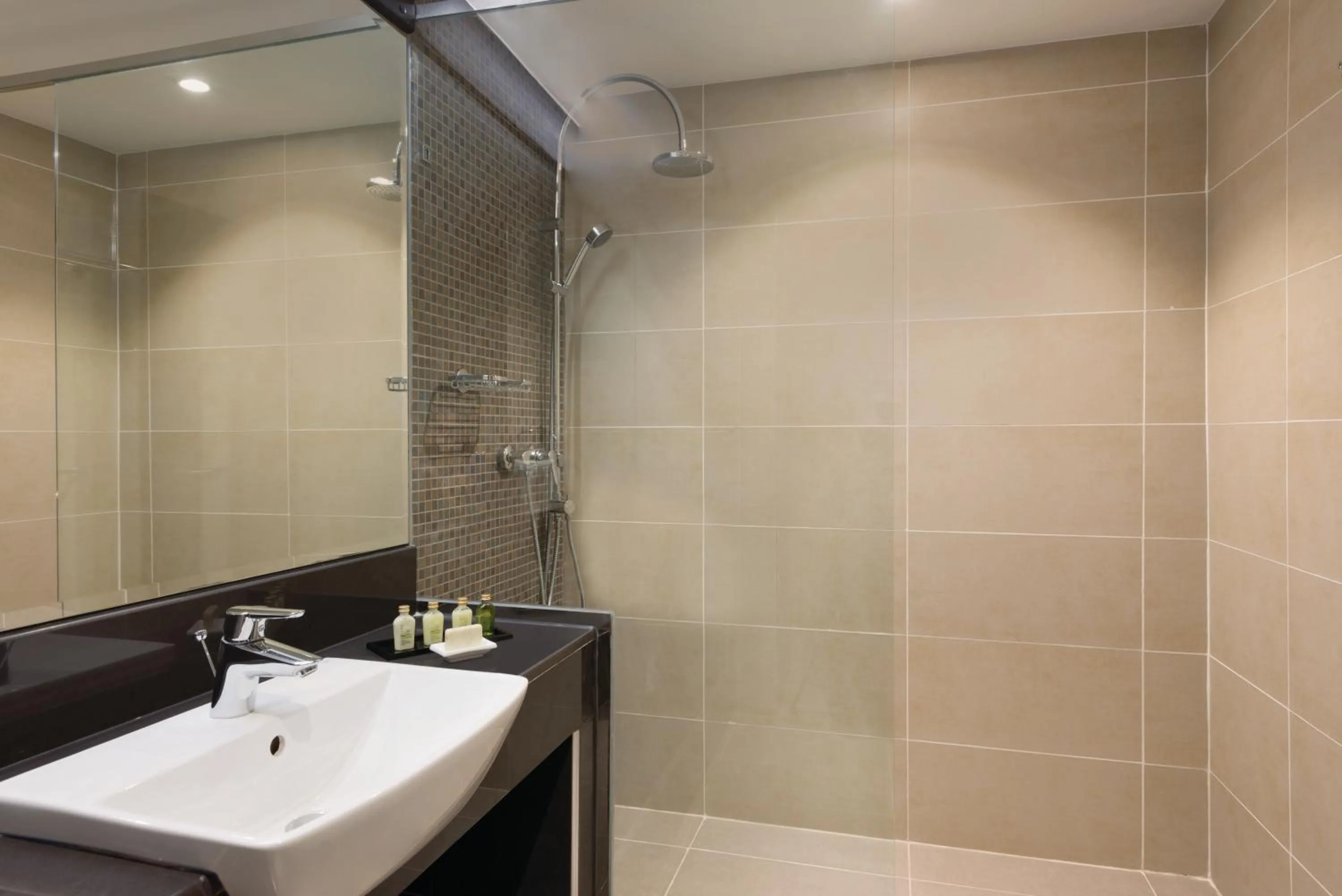 Shower in Ramada Resort By Wyndham Dar es Salaam