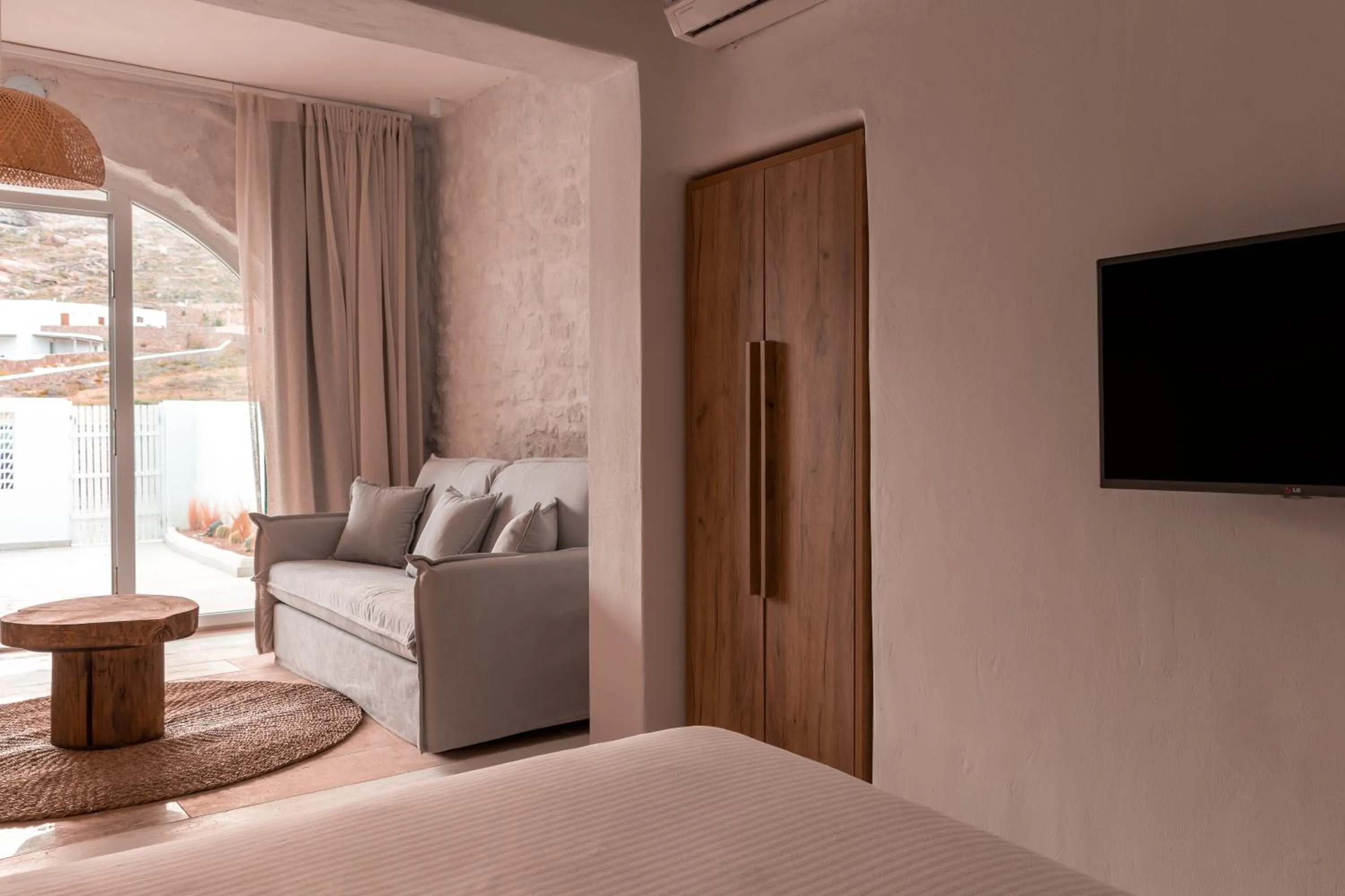 Communal lounge/ TV room, Bed in Senses Luxury Suites & Villas