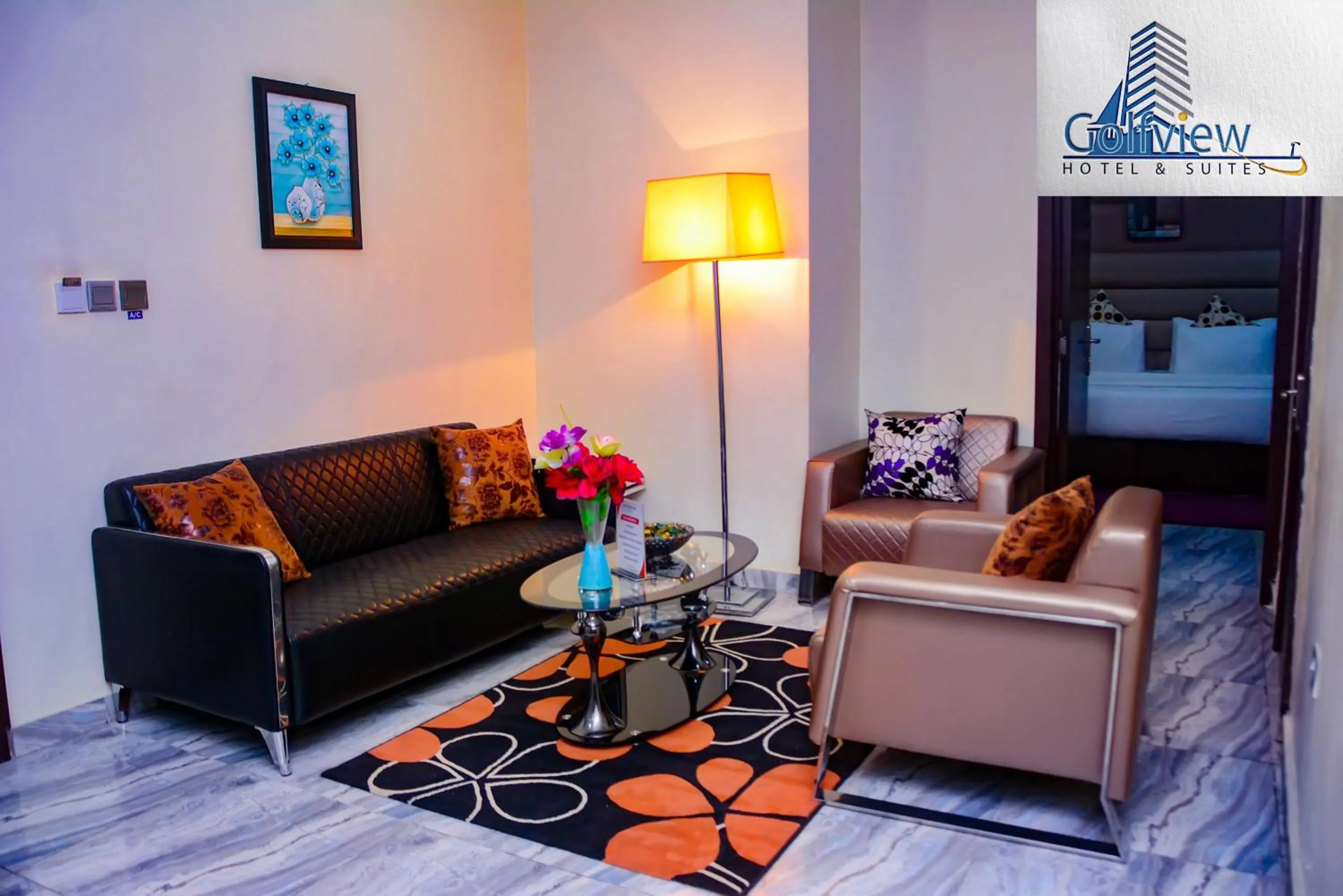 Bed in GolfView Suites & Conference Center