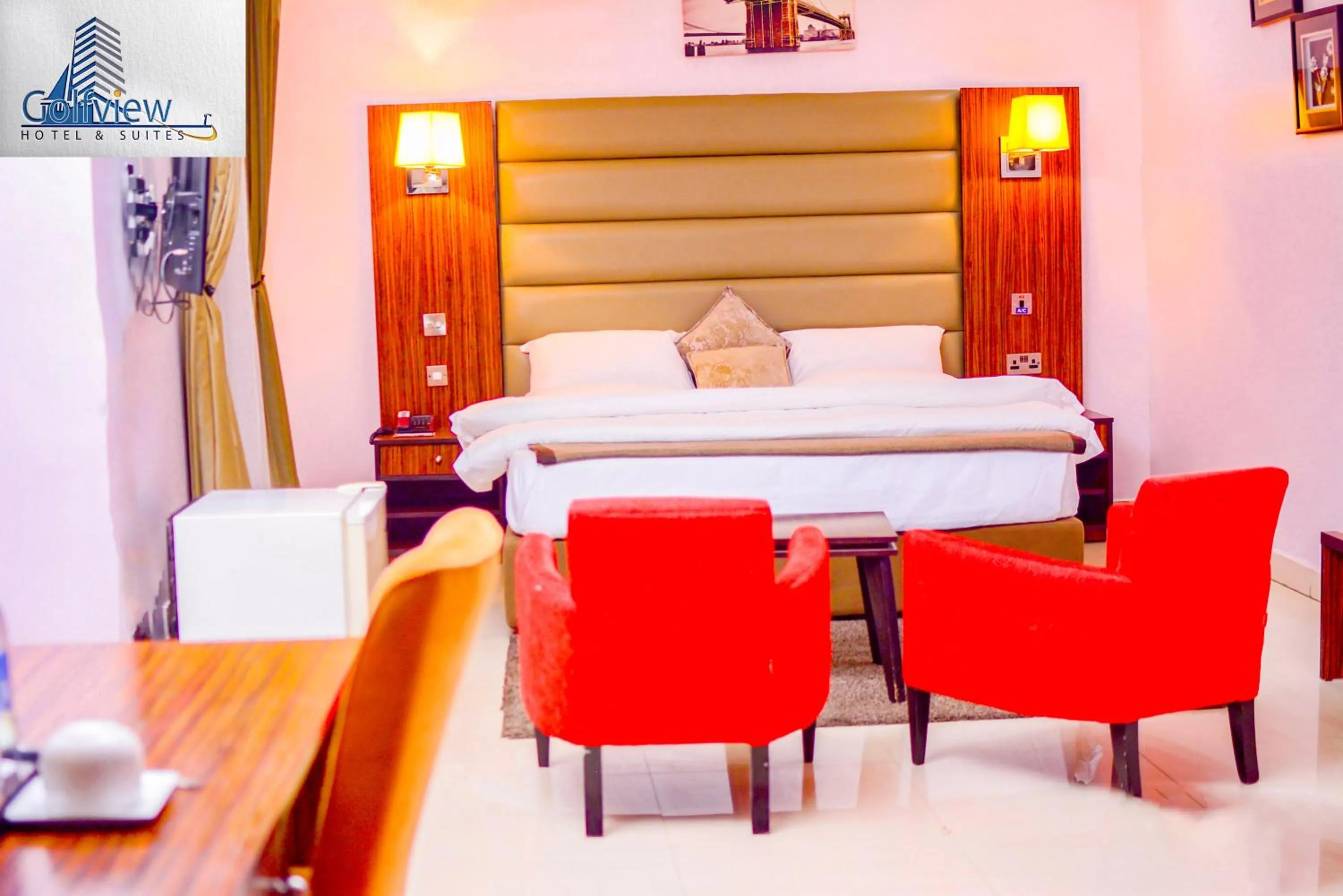 Bed in GolfView Suites & Conference Center