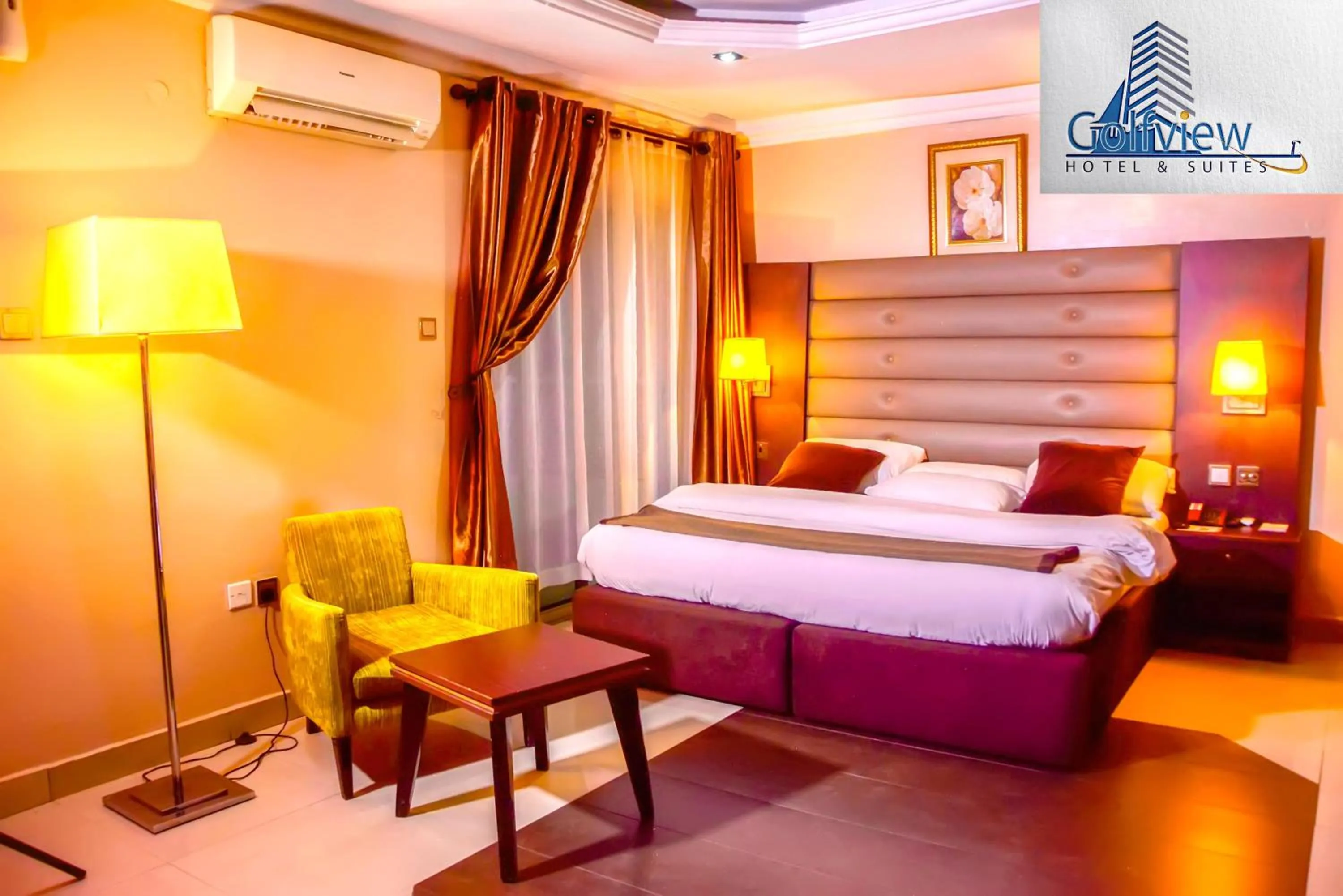 Photo of the whole room, Bed in GolfView Suites & Conference Center