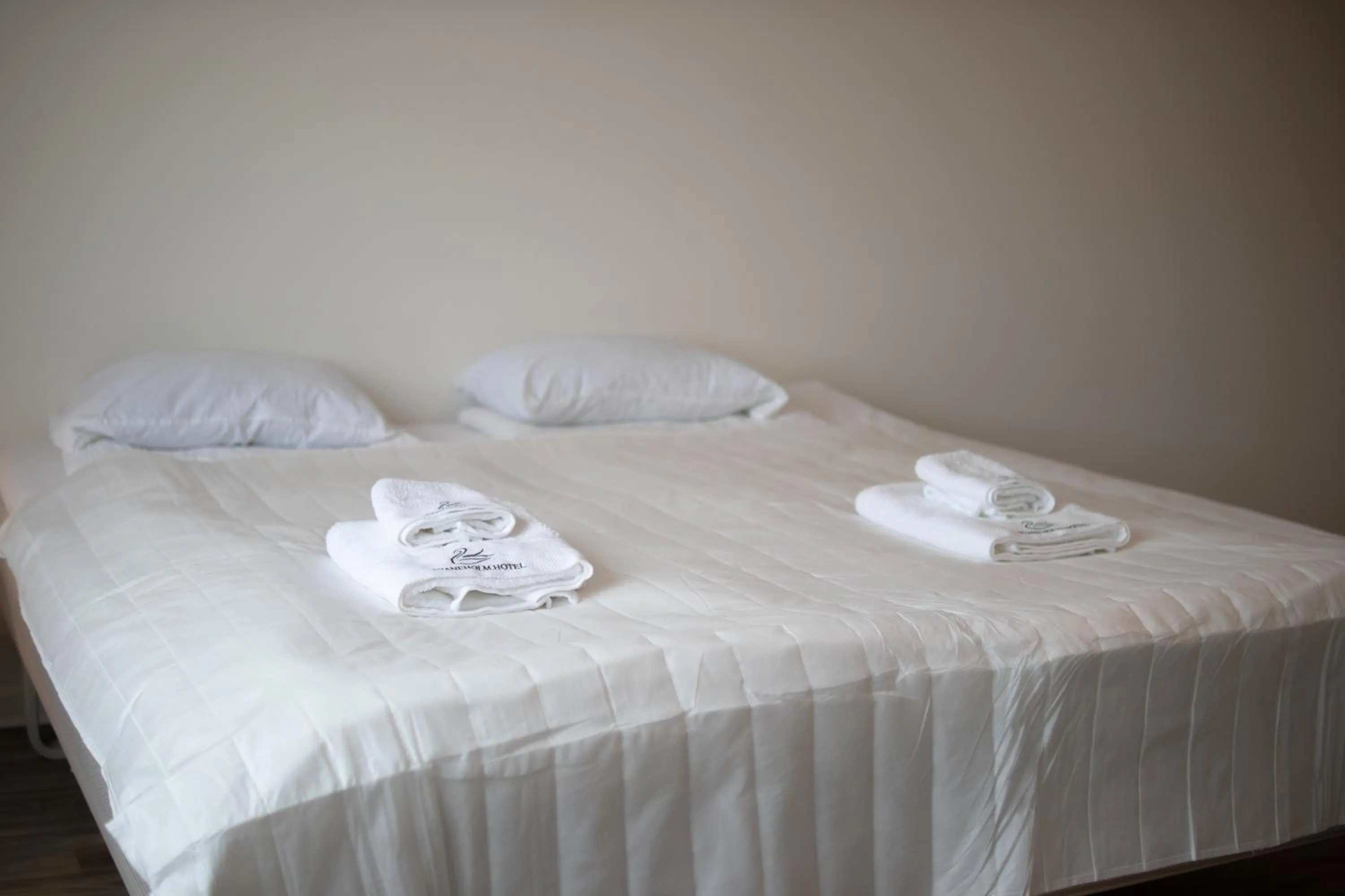 Bed in Säffle Suites by Svaneholm Hotel