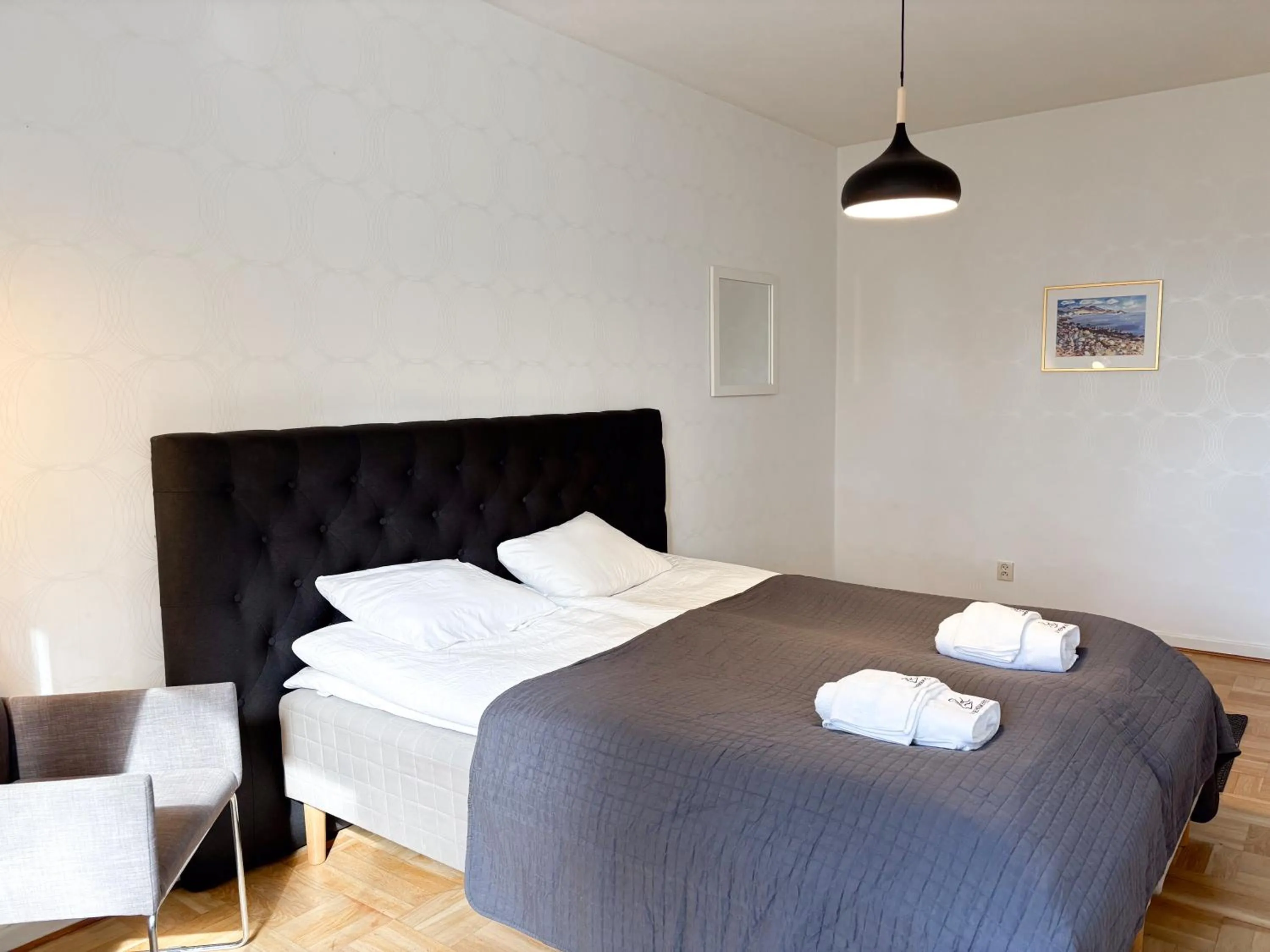 Bed in Säffle Suites by Svaneholm Hotel