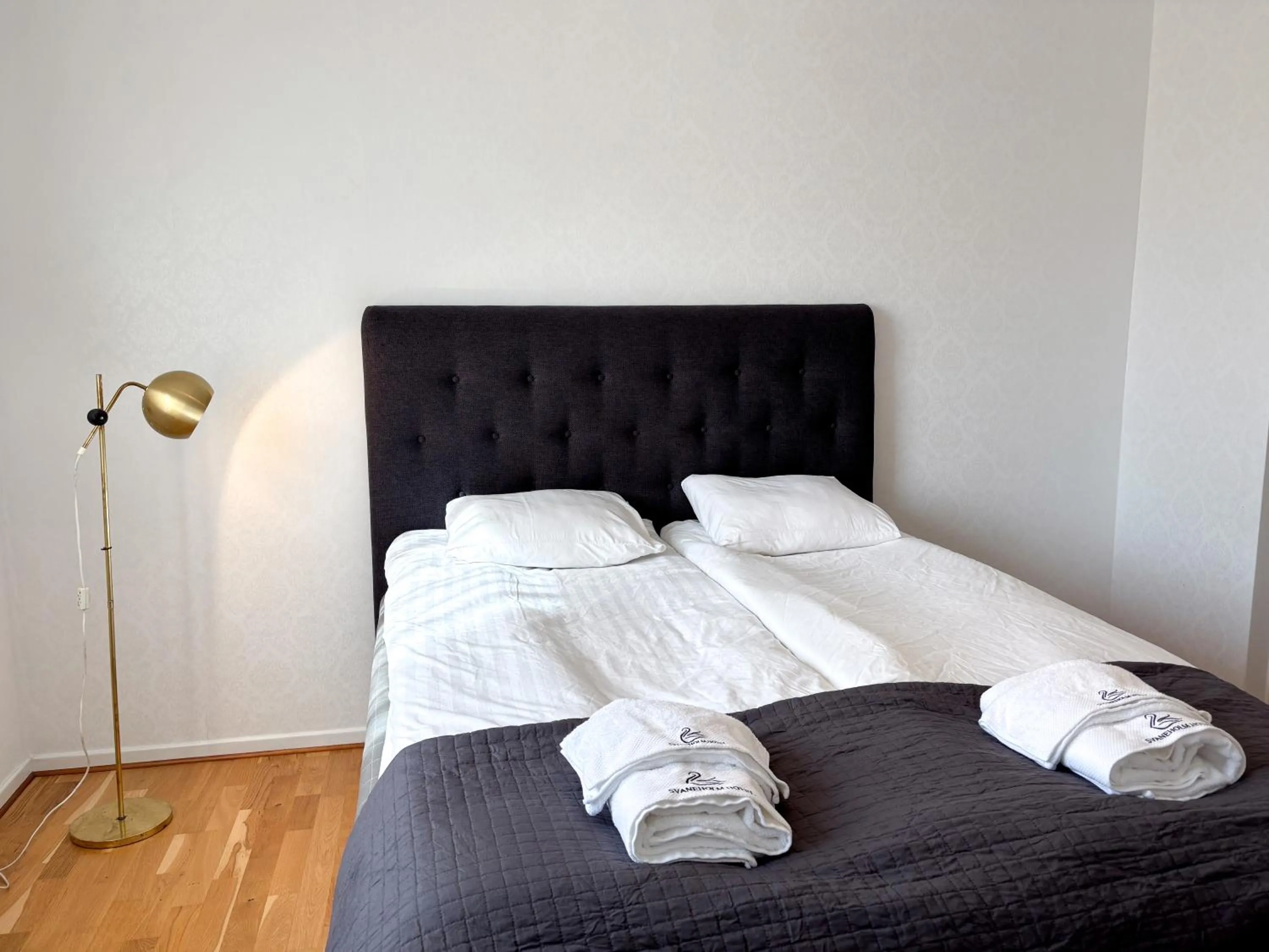 Bed in Säffle Suites by Svaneholm Hotel