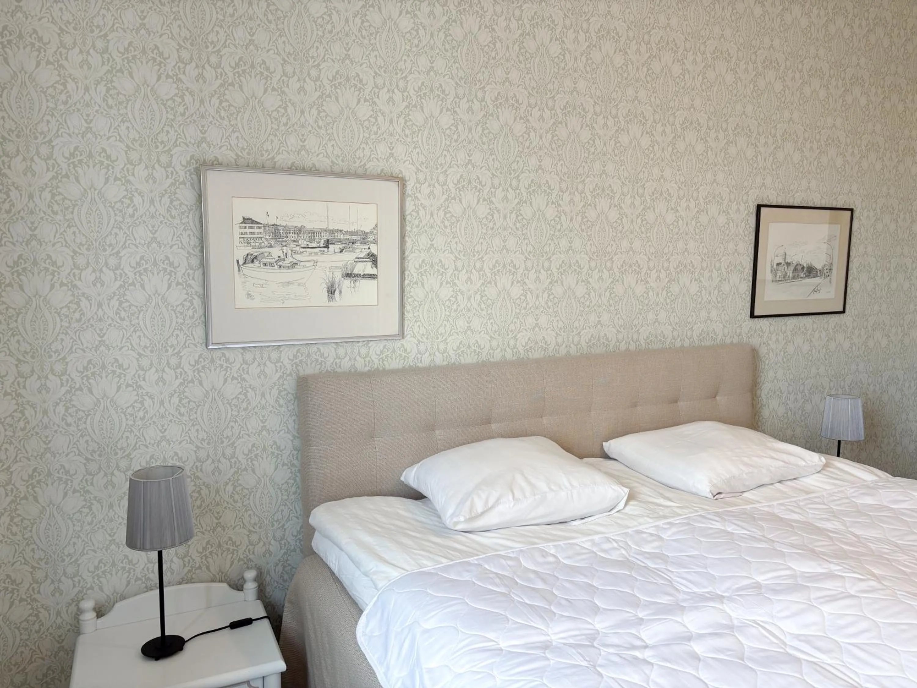 Bed in Säffle Suites by Svaneholm Hotel