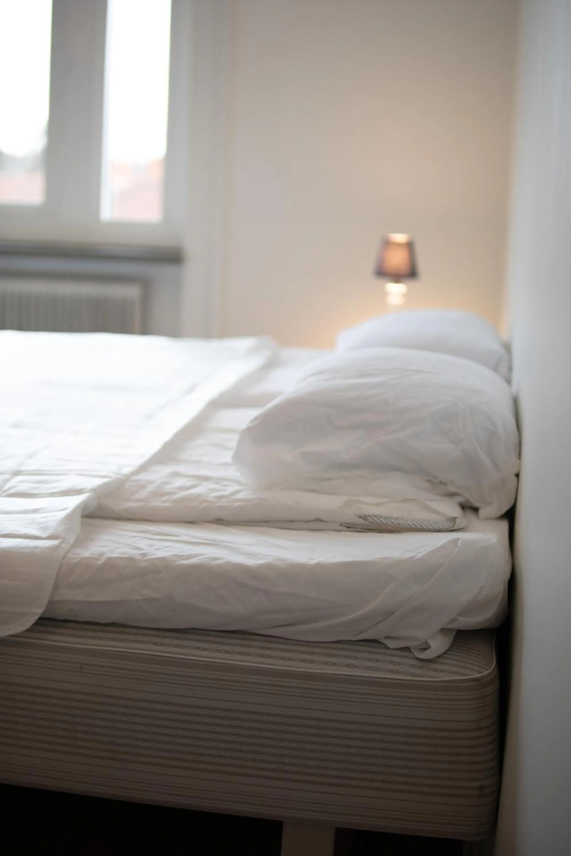 Bed in Säffle Suites by Svaneholm Hotel