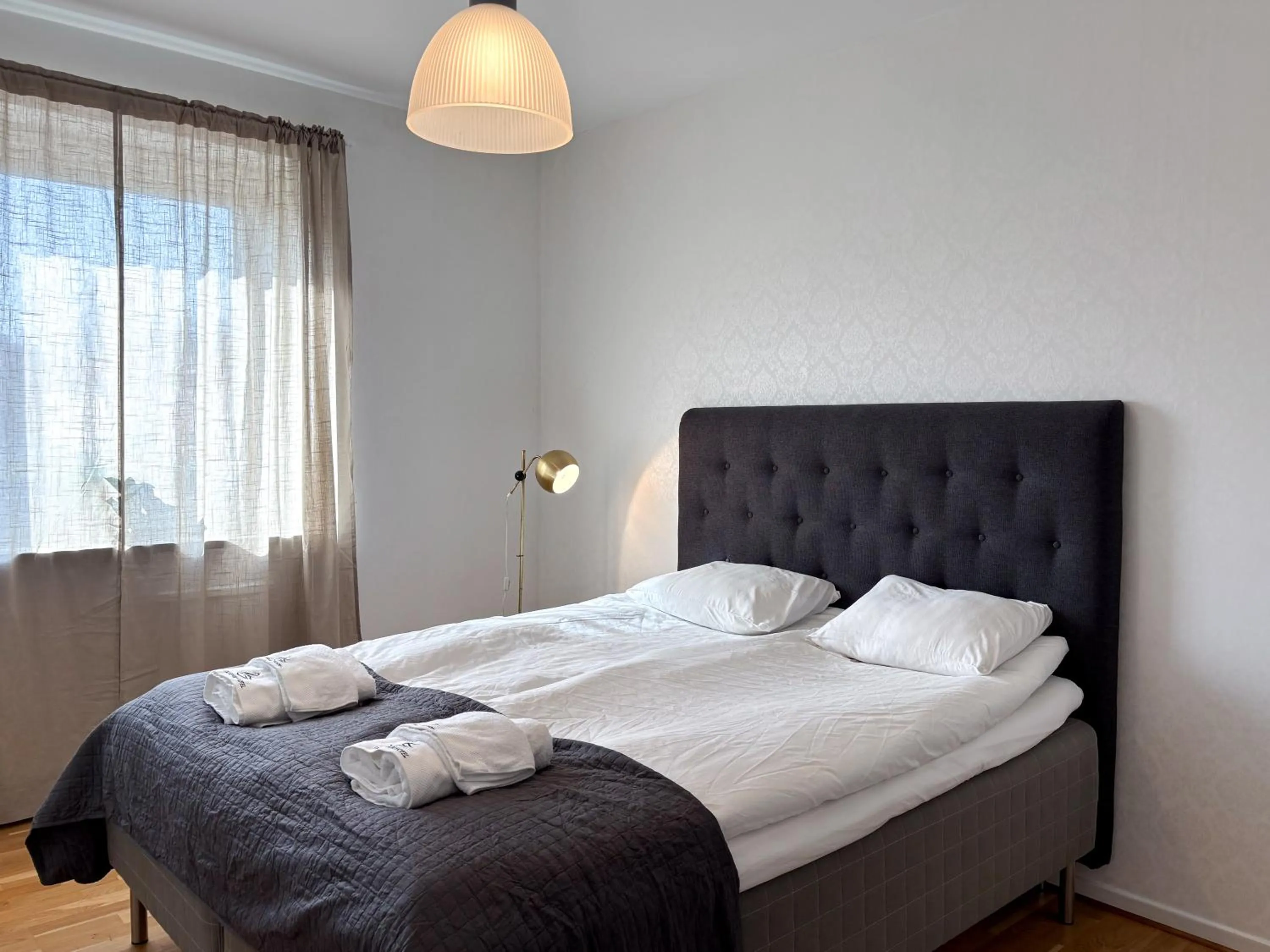 Bed in Säffle Suites by Svaneholm Hotel