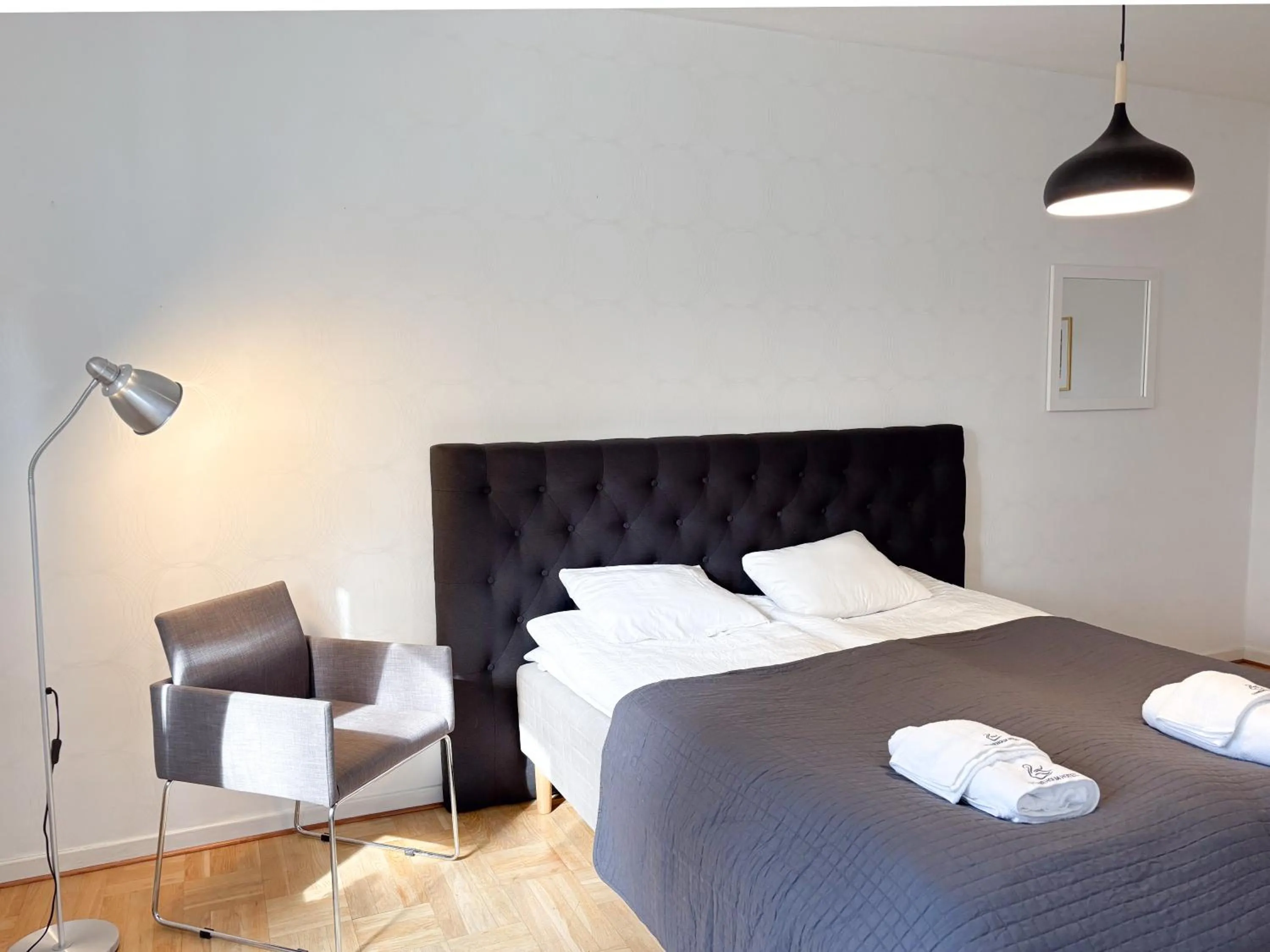 Bed in Säffle Suites by Svaneholm Hotel