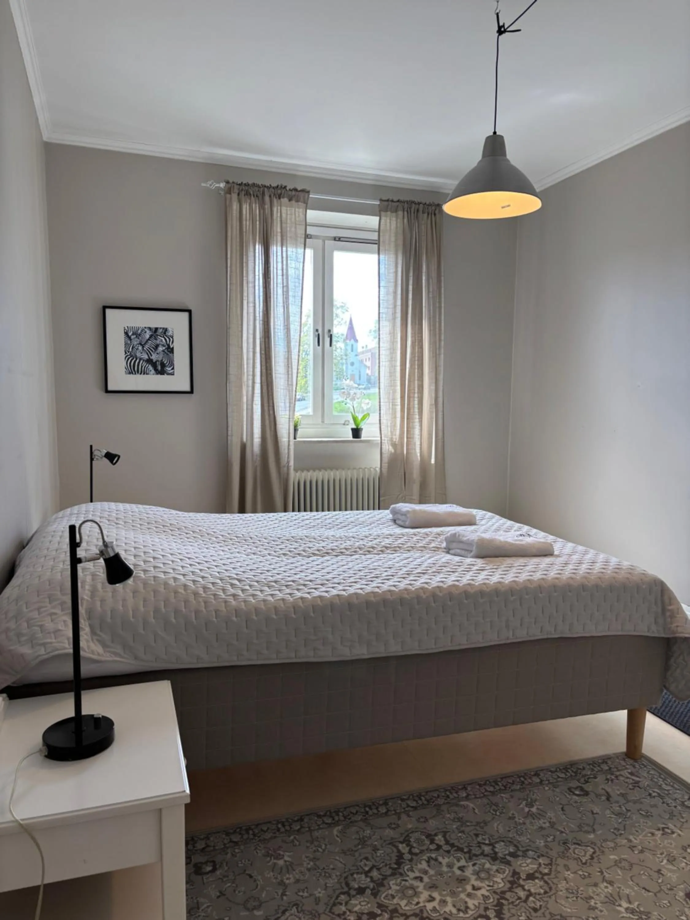 Bed in Säffle Suites by Svaneholm Hotel