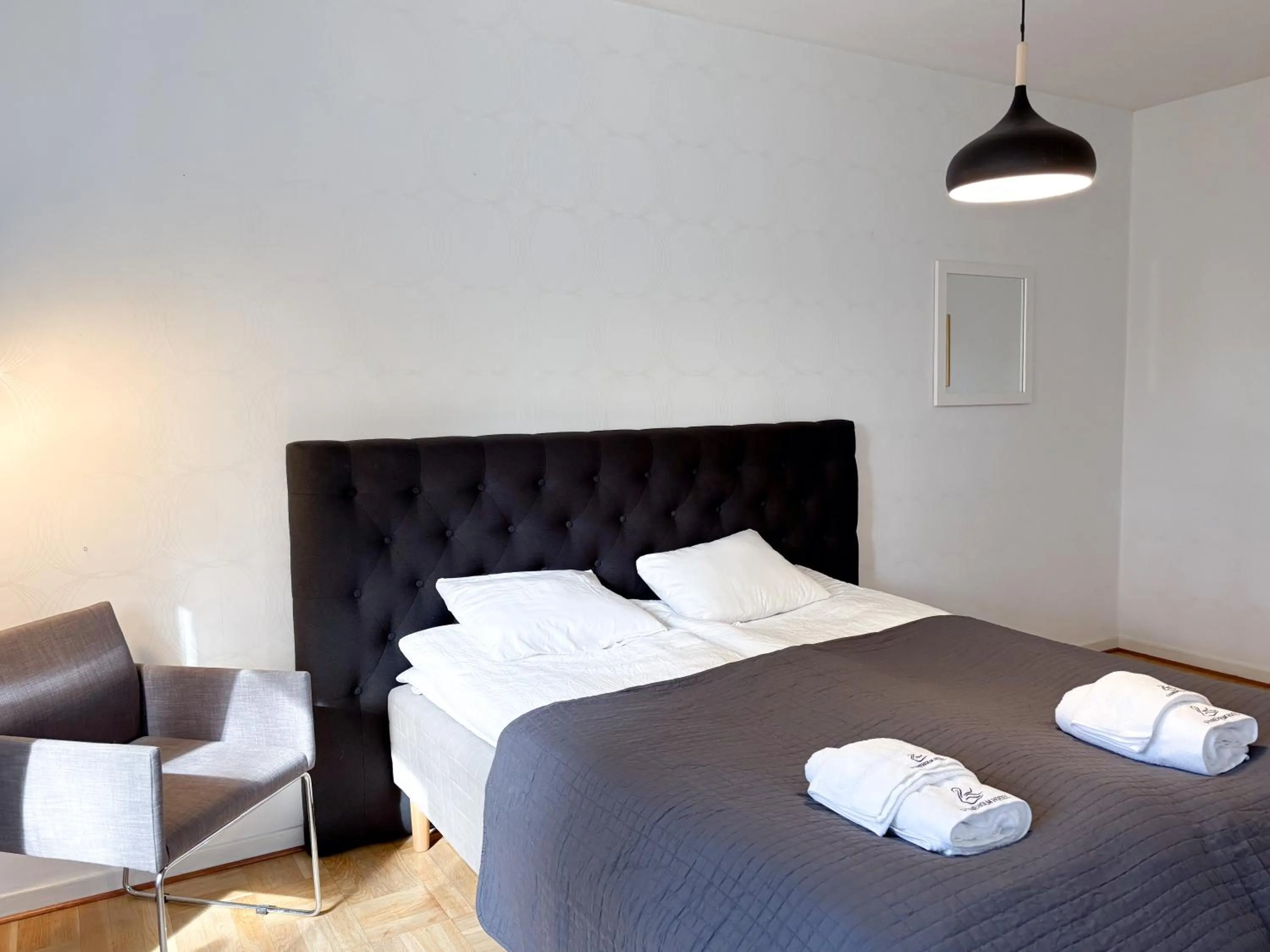 Bed in Säffle Suites by Svaneholm Hotel