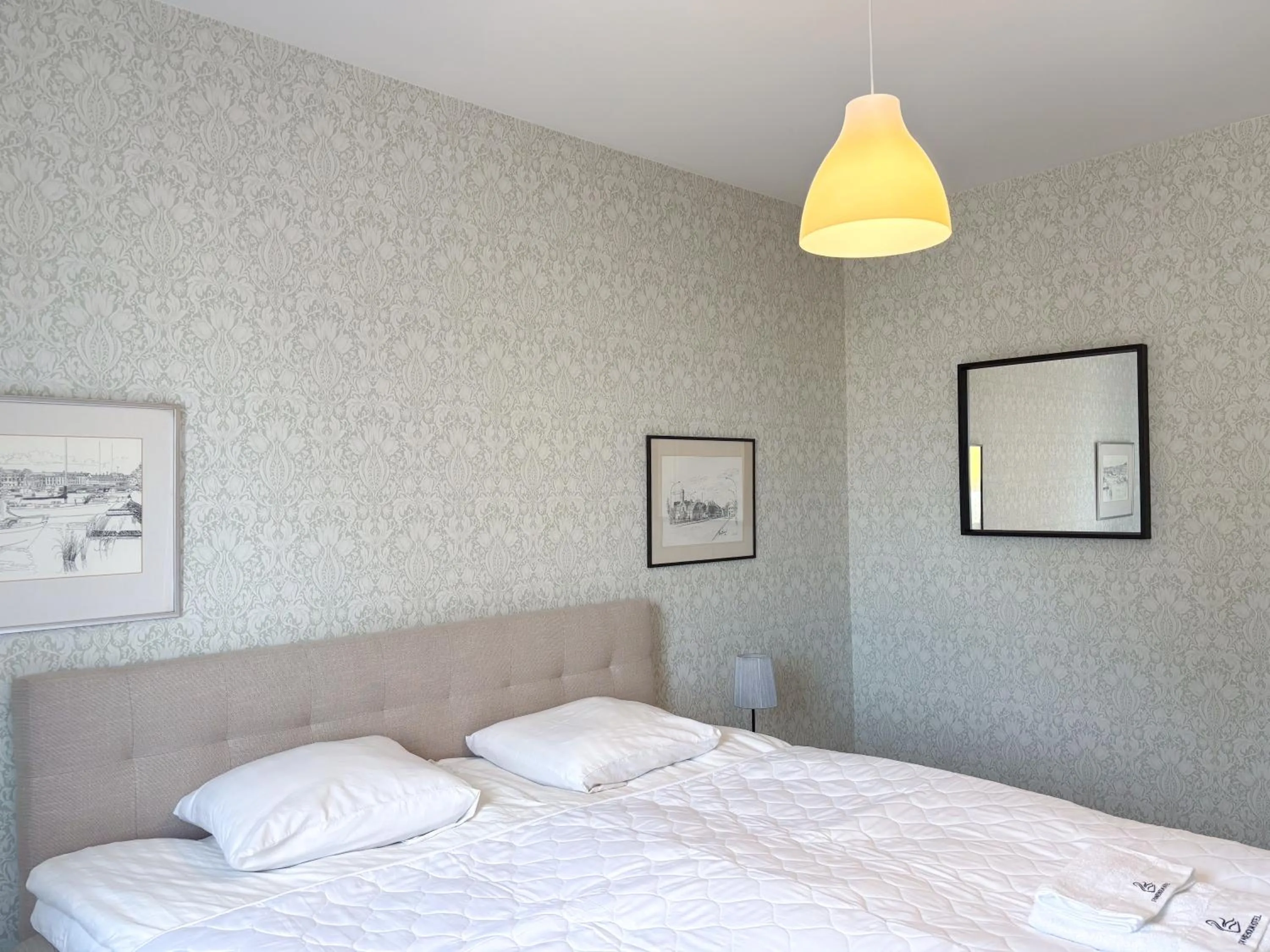 Bed in Säffle Suites by Svaneholm Hotel