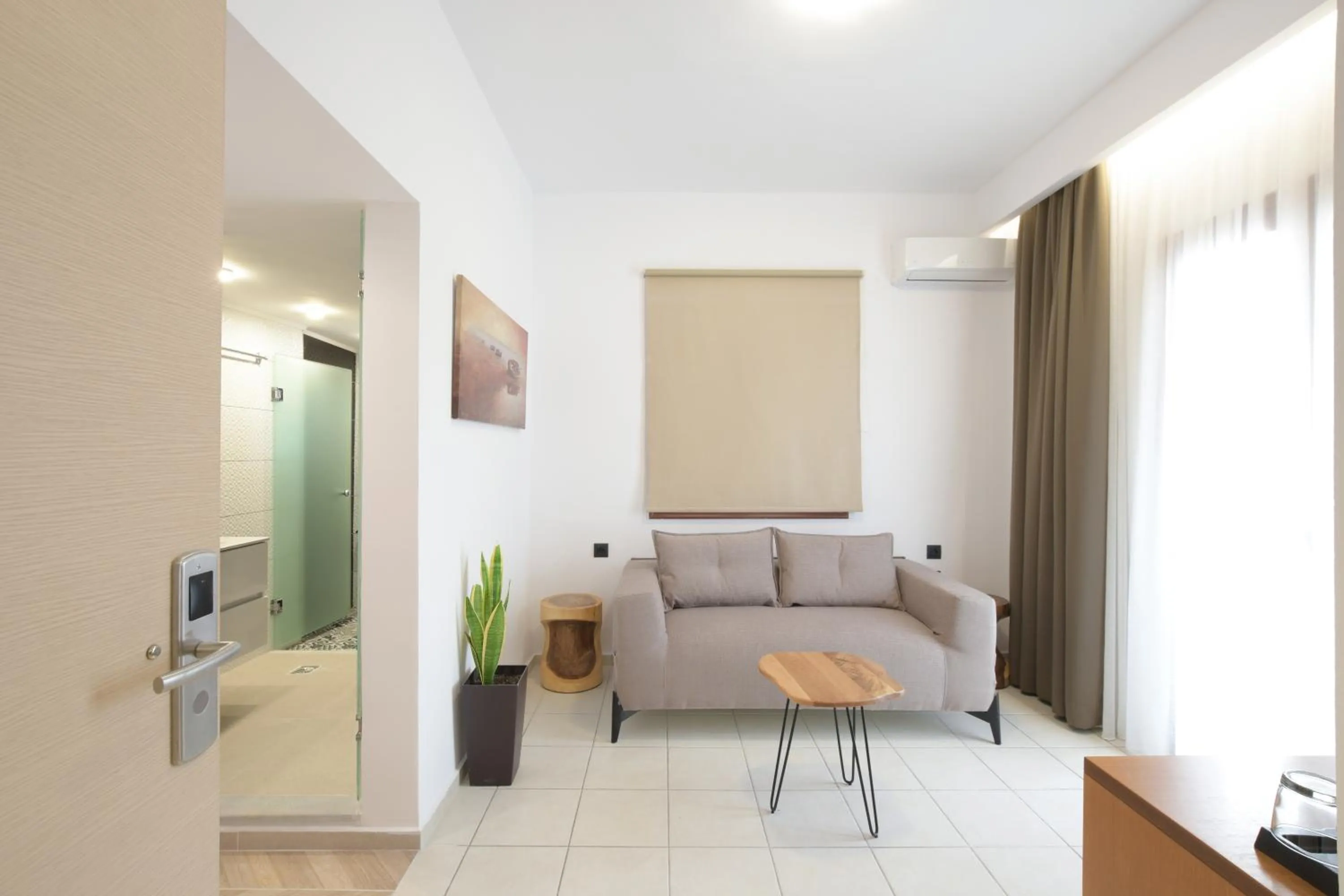 Living room in Georgia's Garden by Omilos Hotels