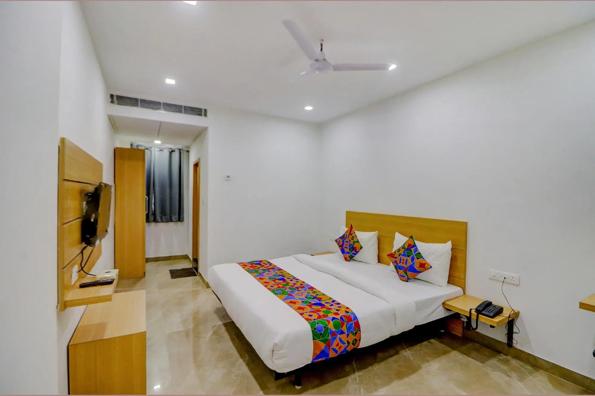 Bed in FabHotel Premium Kashi - Sarnath museum